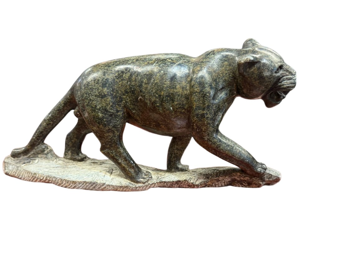 Soapstone figure of a lion: Soapstone figure of a lion. H 7" L 15"