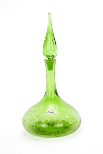 Blenko Green Glass Decanter Mid-Century Modern: A Mid Century Modern green glass decanter with stopper made by Blenko. Retains original label. Dimensions: H: 14.5” x L: 6" x W: 6"