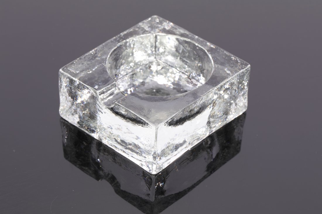 Mid Century Ice Cube Art Glass Ashtray: A vintage 1970’s “ice cube” textured art glass ashtray with round receptacle. Measures: 4.75” x 4.75” x 2”