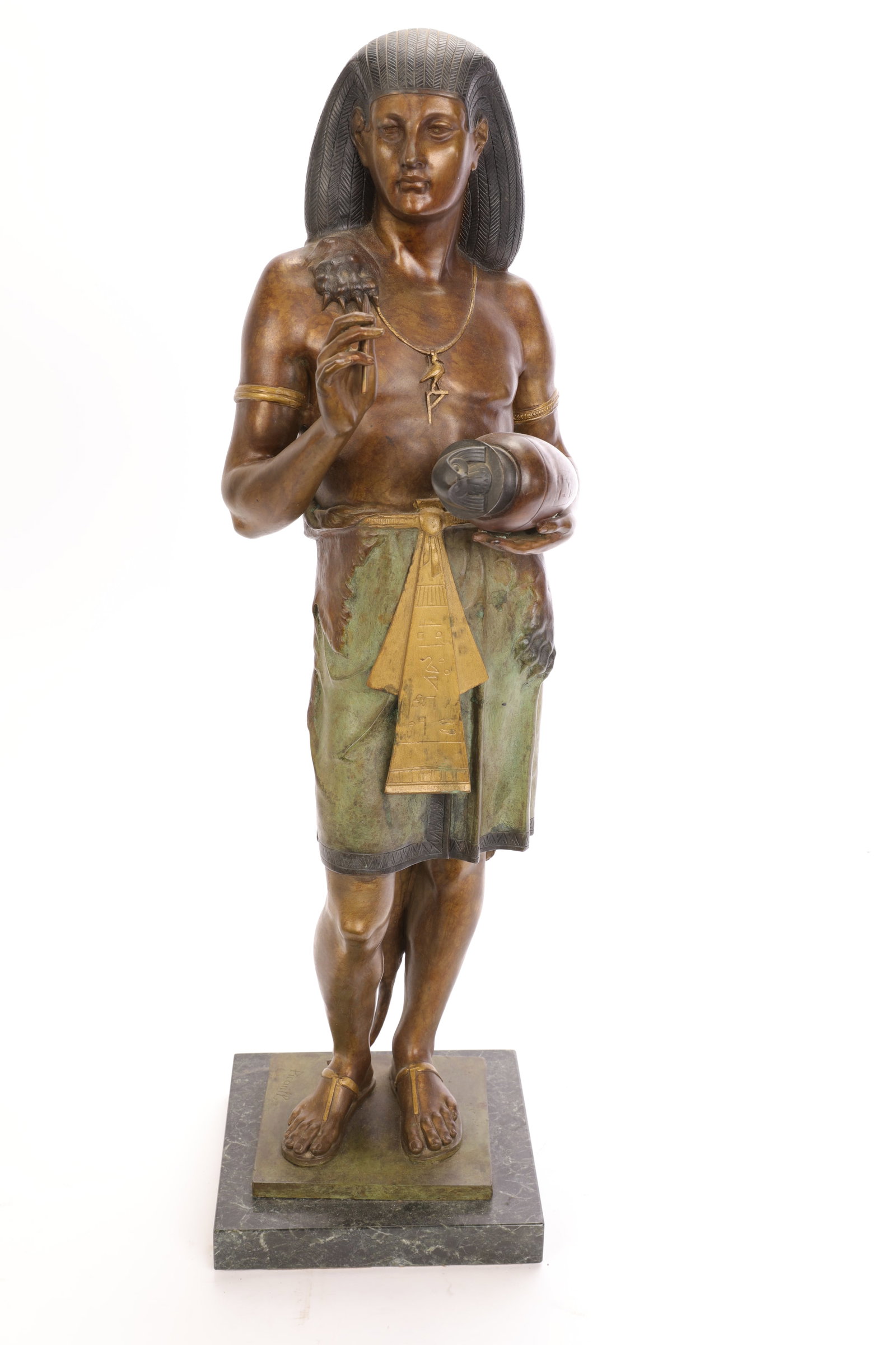 EMILE LOUIS PICAULT (1833-1915) EGYPTIAN REVIVAL BRONZE SCULPTURE 30": A gorgeous Egyptian Revival bronze sculpture of an Egyptian man holding a canopic jar with Horus in one hand and a stylus in the other. The bronze is mounted to a marble base. Signed by the artist on 