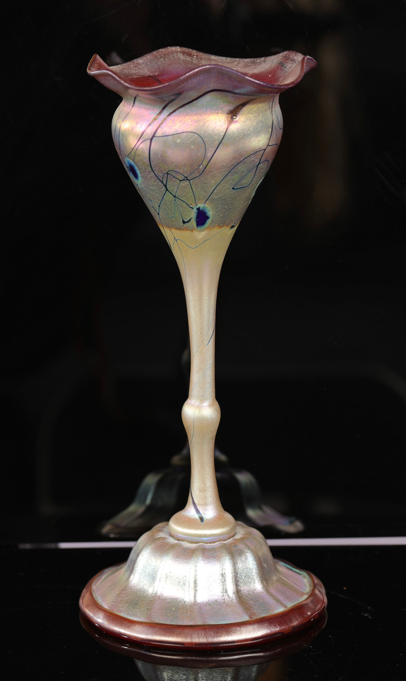 FLORIFORM FAVRILE GLASS GOBLET PEACOCK ROSE: A lovely floriform favrile glass goblet with rose glass interior and peacock iridescent exterior. This is a Tiffany form. This vase is unsigned. As pictured. No damage noted. Measurements:10" H x 4.5"