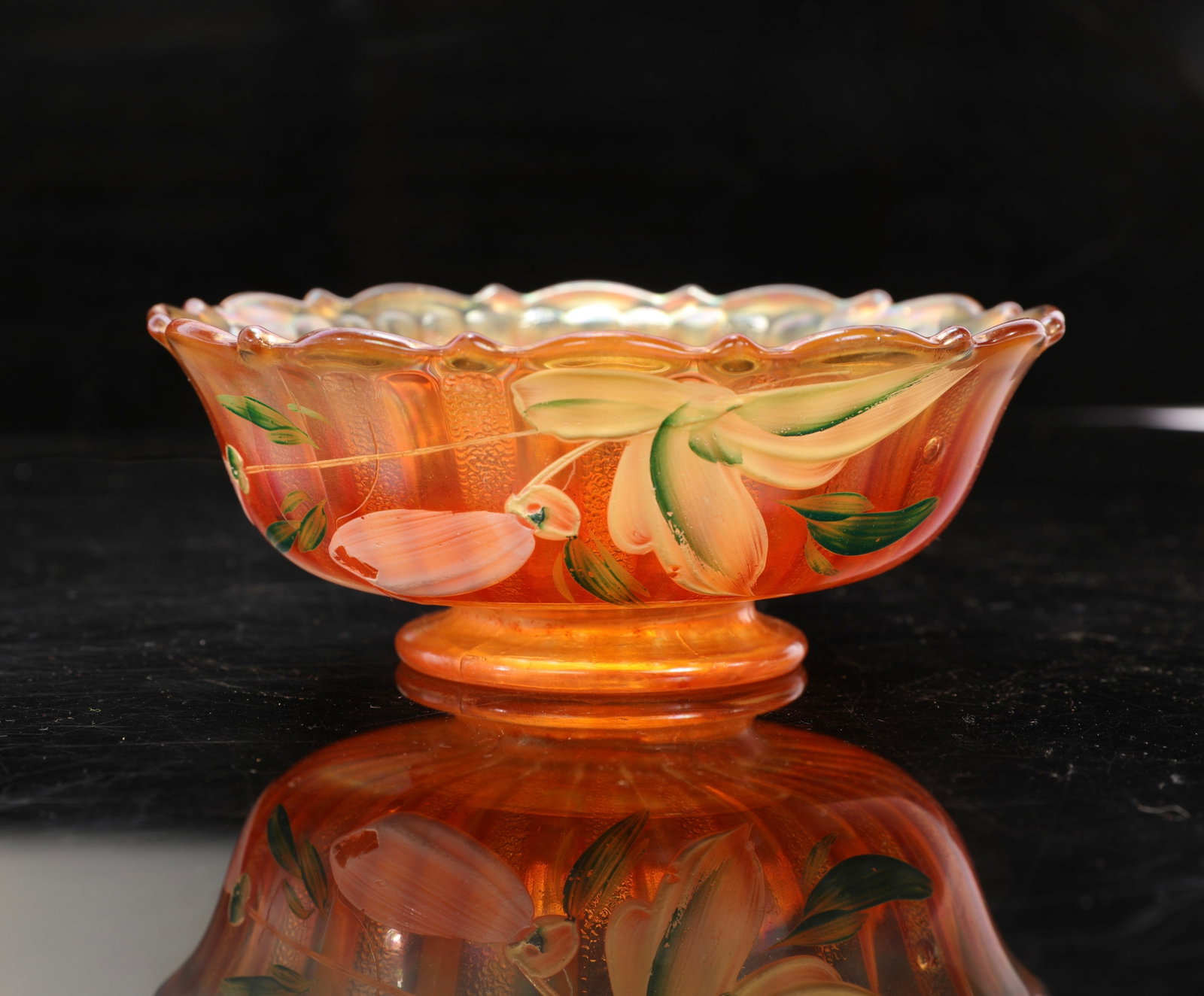CARNIVAL GLASS BOWL W/ HAND-PAINTED FLOWERS: A carnival glass bowl with hand-painted flowers. As pictured. No chips, cracks or repairs noted. Measurements:2" H x 5.5" diameter