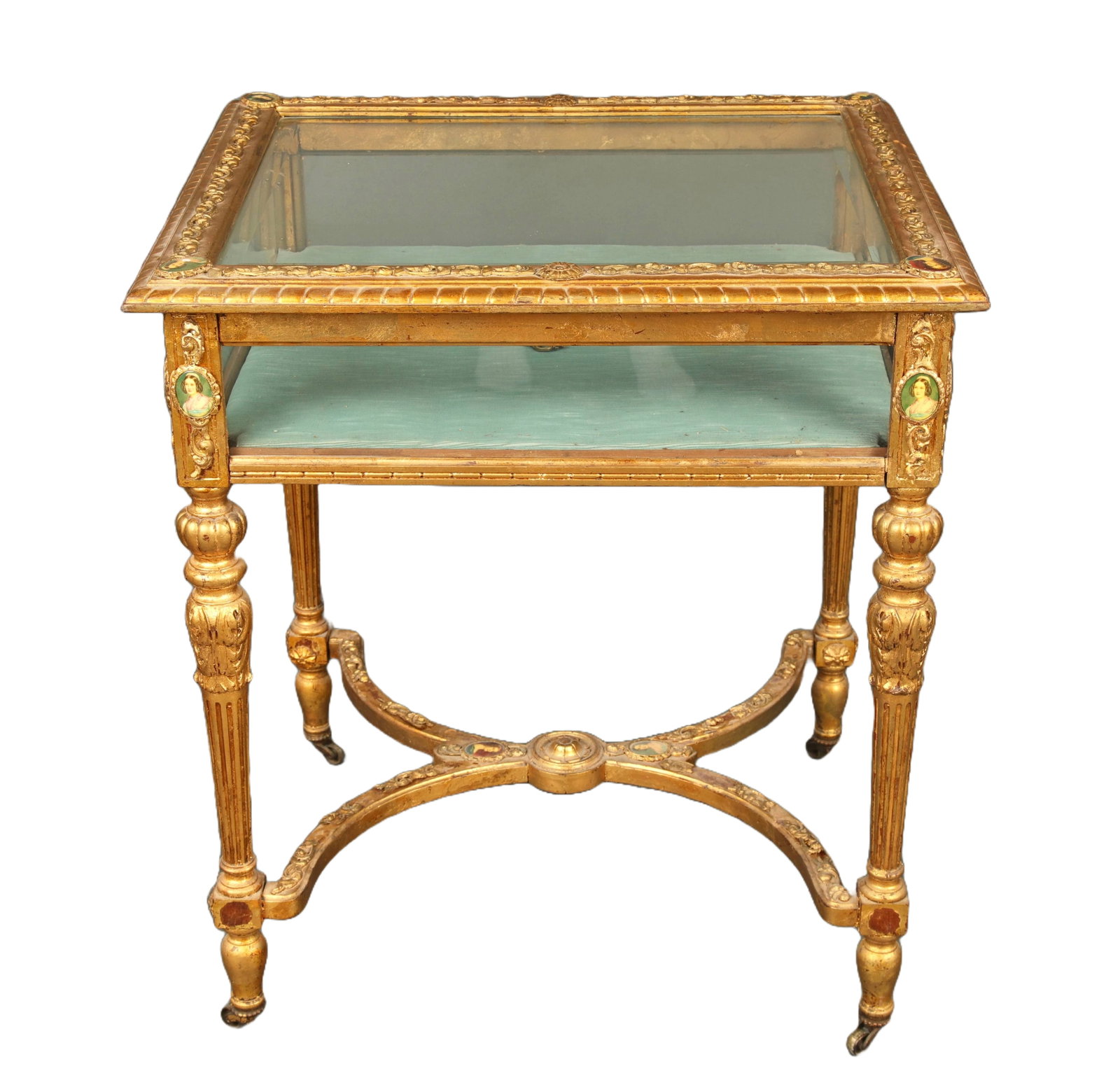 LOUIS XVI GILTWOOD VITRINE CURIO CASE W/ PORTRAIT MEDALLIONS: A stunning antique Louis XVI style giltwood vitrine with glass sides and top and miniature portrait medallions. The case is on wheels and includes 2 keys. Measures: 29.5" H x 26" W x 22.25" D.