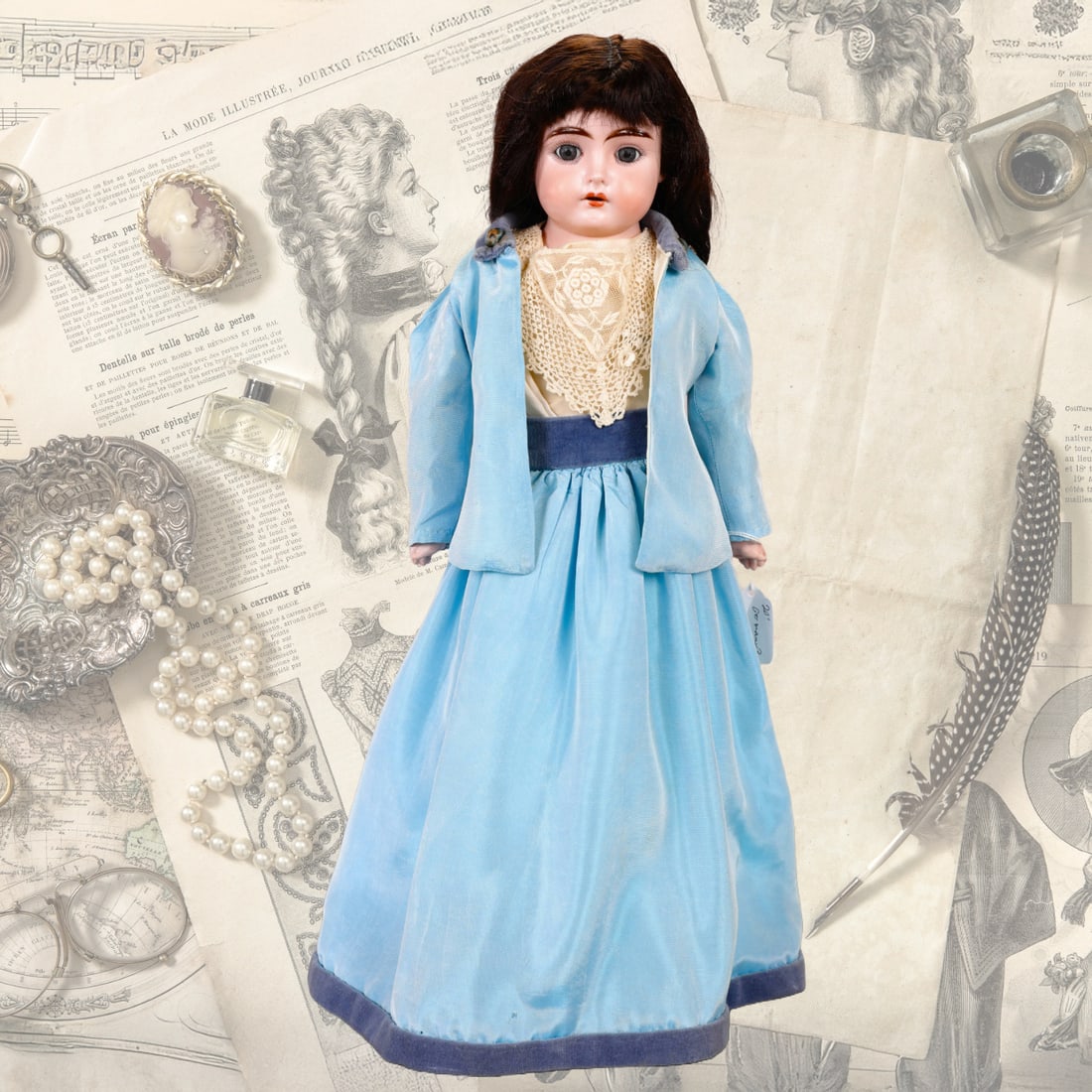 20" GERMAN DARLING ANTIQUE BISQUE DOLL: Maker: Darling 1 marked on back of shoulder plate Size: 20" Material: bisque head, arms & legs with kid leather body. Details: Human hair wig, brown eyes, open mouth with 4 teeth. Includes clothing sh