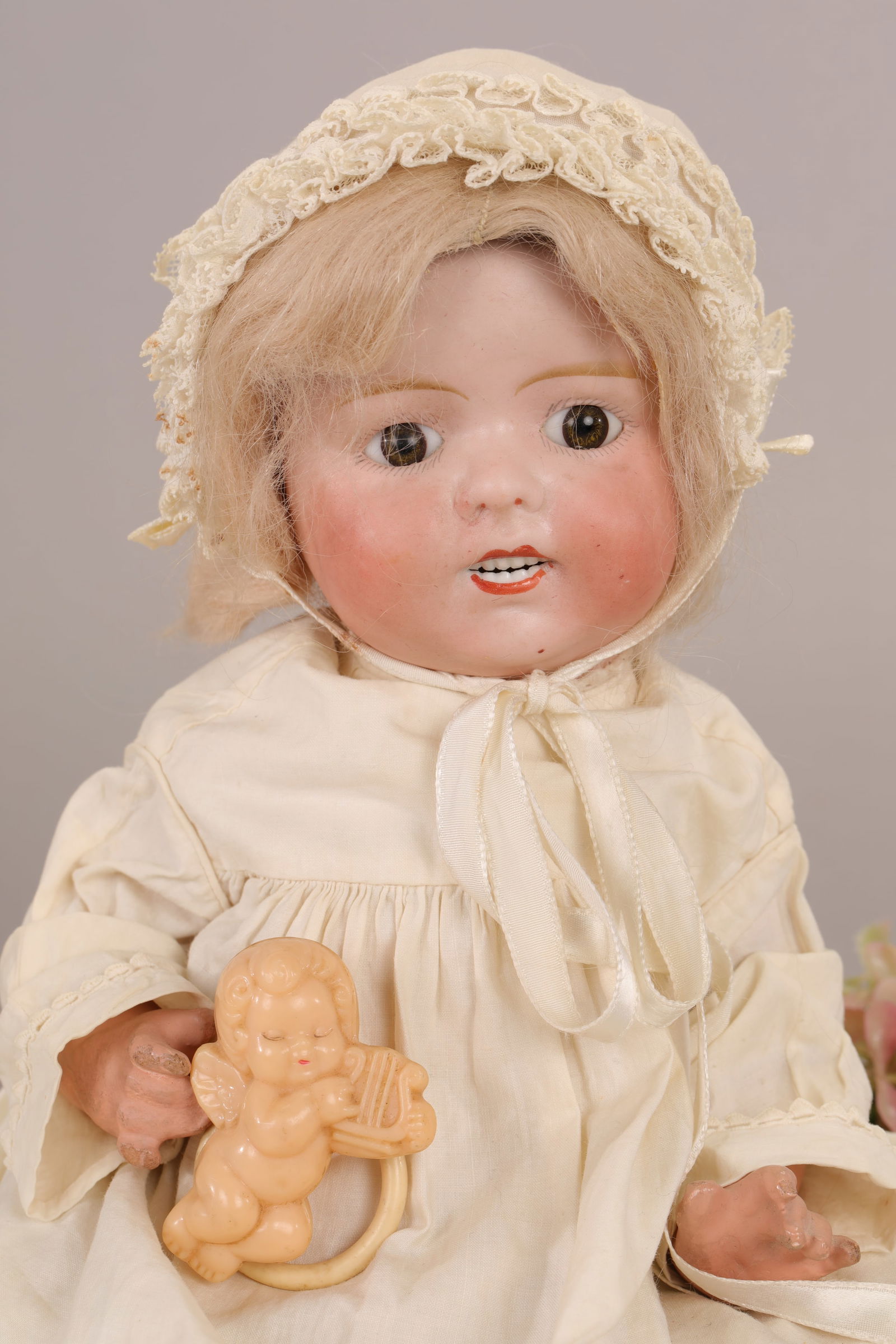 GRINNIE DOLL LANTERNIER ANTIQUE FRENCH BISQUE 2 ROWS OF TEETH: Maker: Lanternier, France Marks: Unmarked Size: 12-13" tall Age: Antique, early 20th c. Materials: Bisque head with blonde wig, blue eyes, two rows of teeth, composition body Details: Comes with cloth