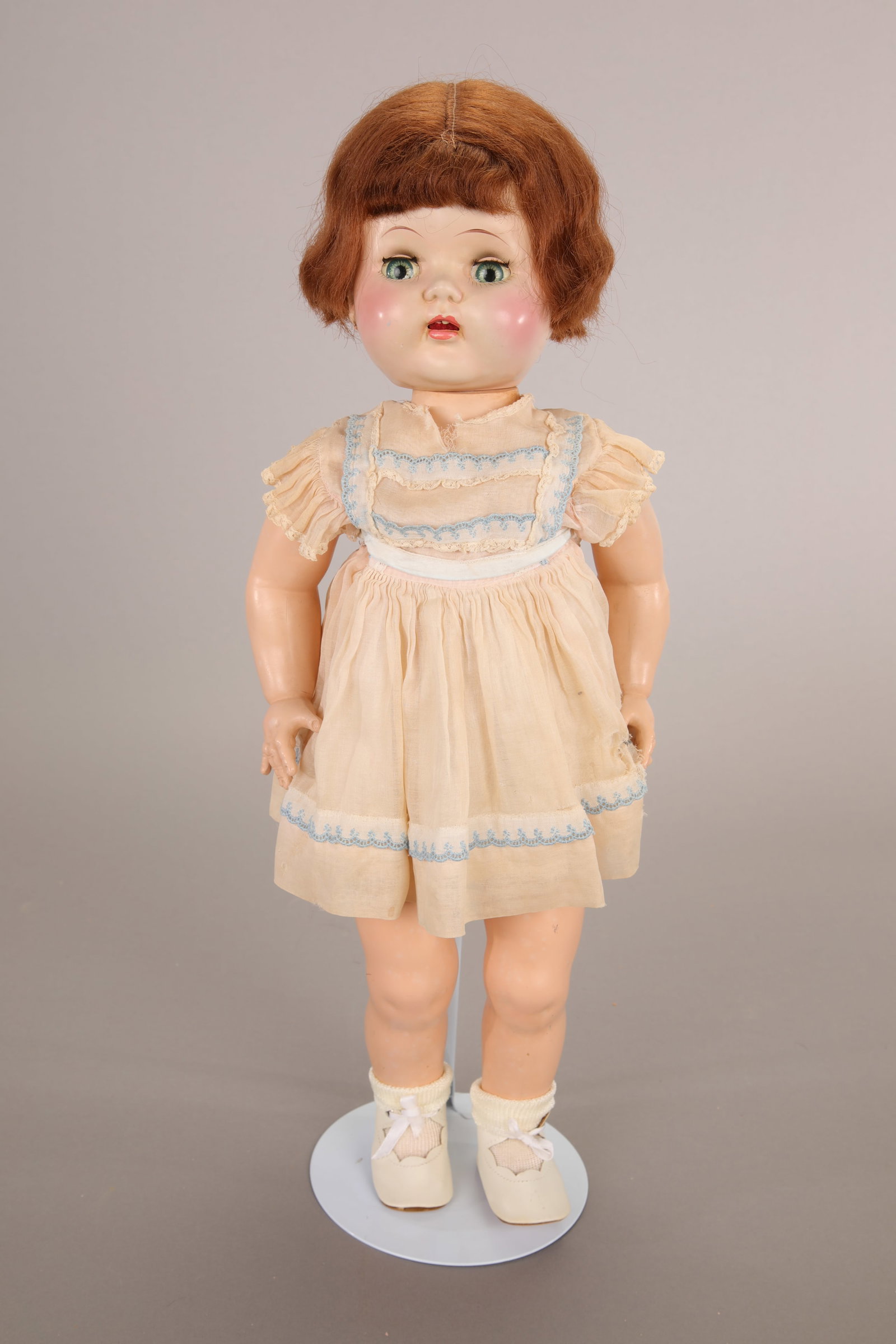 SAUCY WALKER TYPE 22-23" HARD PLASTIC DOLL: Maker: Unknown Marks: Unmarked Size: 22-23" Materials: hard plastic with speaker (doesn't work?), green sleepy eyes, open mouth with two teeth, short auburn/red hair wig Age: 1950s Details: Includes c
