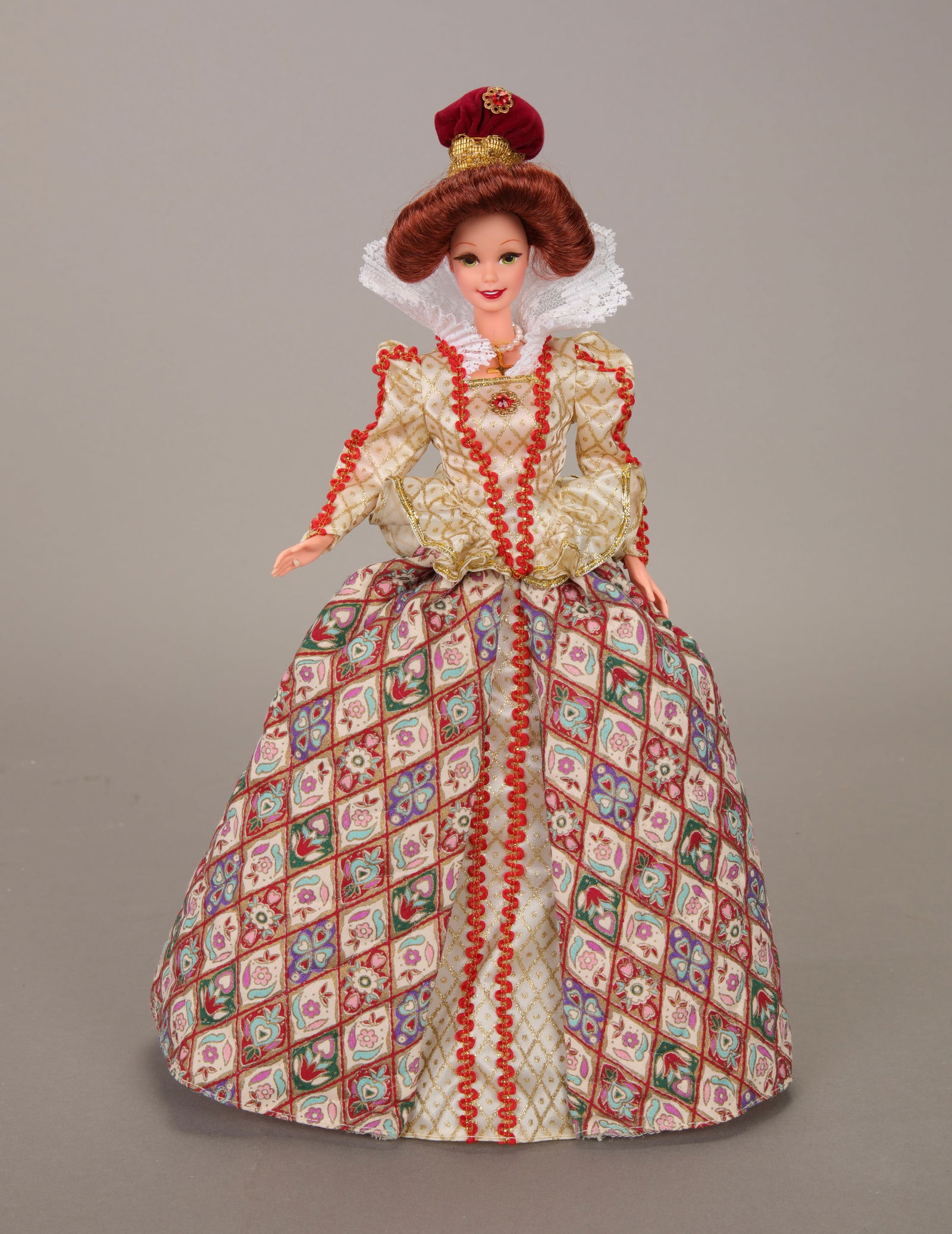 ELIZABETHAN QUEEN BARBIE DOLL GREAT ERAS COLLECTION: An Elizabethan Queen Barbie Doll from the Great Eras Collection. The doll is dressed in traditional Renaissance clothing and comes with her stand. Made by Mattel. 11.5" Tall. 1995.