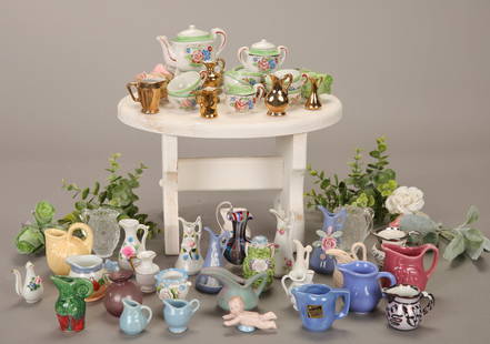 VTG DOLL PORCELAIN TEA SET & MINIATURE PITCHERS & VASES LOT: A lot of vintage doll or child's sized porcelain tea set dishes and a lot of vintage porcelain and glass pitchers and vases. Includes all items pictured, except the white table.