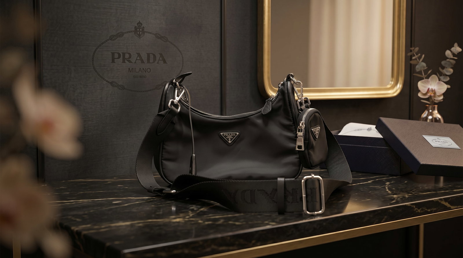 PRADA IT-BAG RE-EDITION 2005 RE-NYLON SHOULDER HANDBAG: This is a Prada Re-Edition 2005 Re-Nylon Shoulder Bag, a modern revival of a classic 2005 silhouette. It is one of Prada's most popular "it-bags" due to its versatile, multi-functional design. Materia