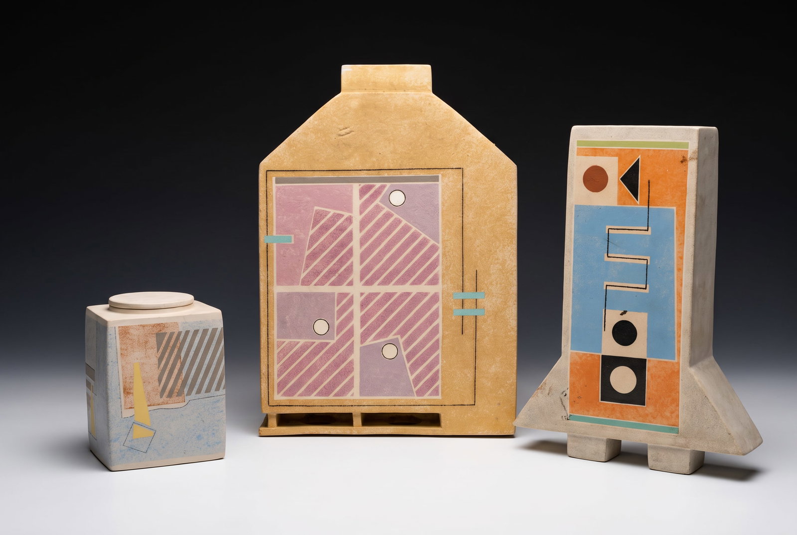 ANDREW VAN ASSCHE TRIO OF MEMPHIS STYLE STUDIO ART POTTERY SCULPTURES: Andrew Van Assche Studio Art Pottery Vessels – Three-Piece Lot This is a highly sophisticated, three-piece collection of contemporary studio art pottery by the acclaimed Massachusetts ceramicist And