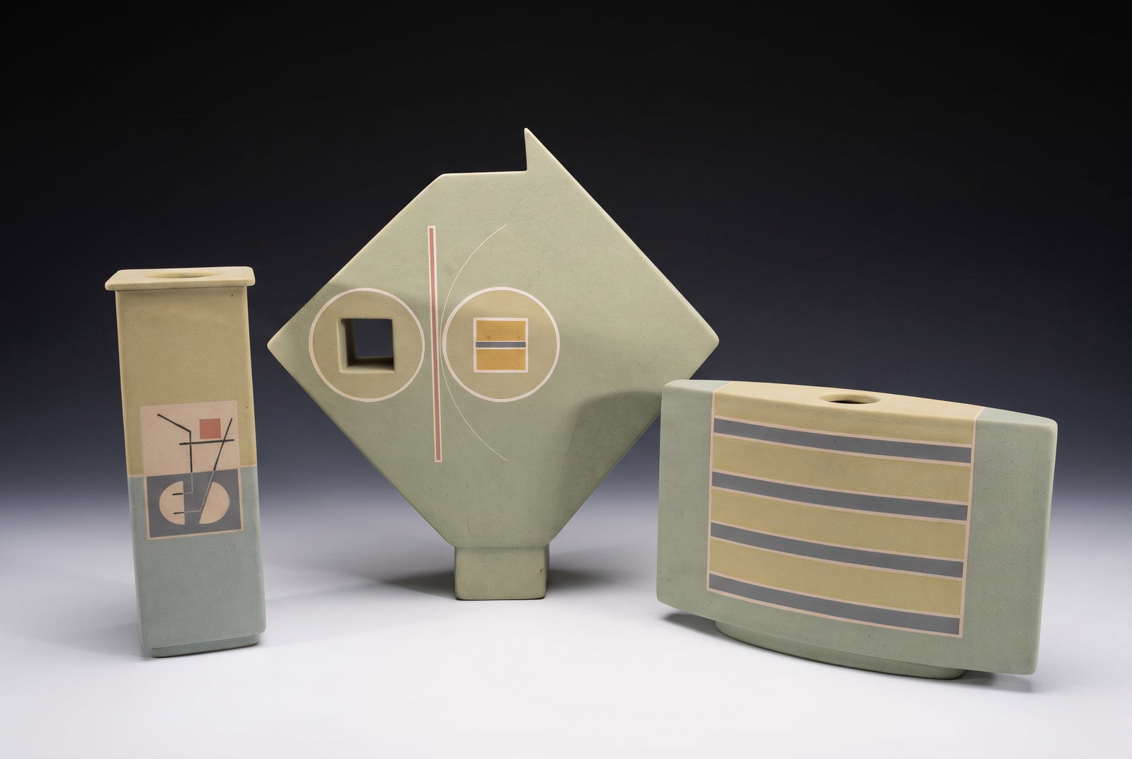 ANDREW VAN ASSCHE TRIO OF MEMPHIS STYLE STUDIO ART POTTERY SCULPTURES: Andrew Van Assche Studio Art Pottery Vessels – Three-Piece Geometric Trio This is a highly sophisticated, three-piece collection of contemporary studio art pottery by the acclaimed Massachusetts cer