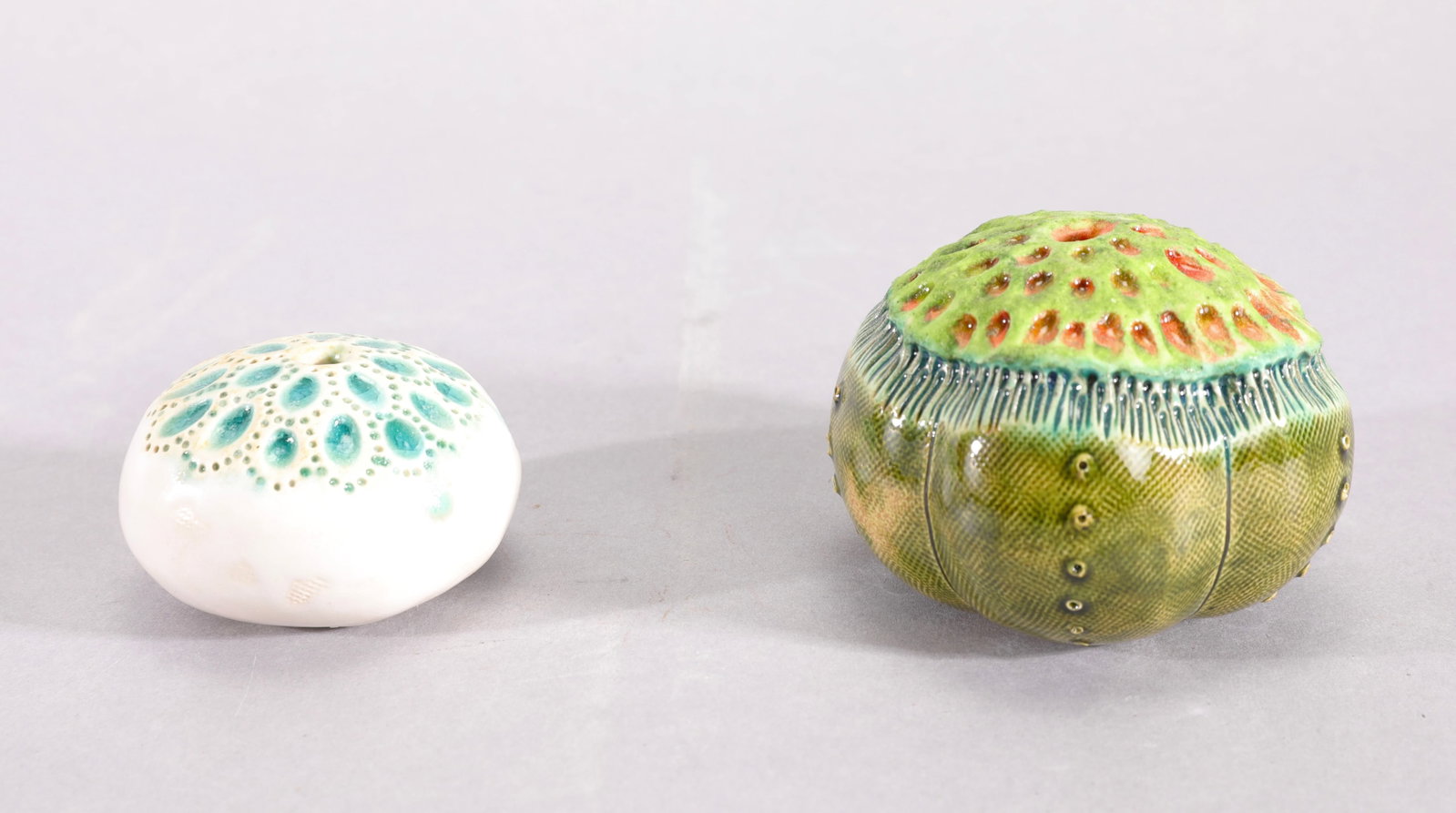 DENISE KRUEGER PAIR OF BOTANICAL STUDIO ART POTTERY SCULPTURES: Lot of Two (2) Botanical Studio Art Pottery Sculptures by Denise Krueger This exquisite two-piece lot captures the organic, nature-inspired ceramic artistry of Pacific Northwest studio potter Denise K