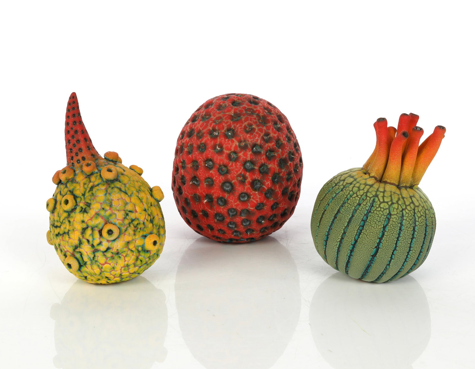 WILLIAM KIDD BOTANICAL-MARINE POP ART STUDIO CERAMIC SCULPTURES: Lot Description This auction features an exceptional three-piece lot of contemporary studio art pottery by renowned ceramic artist William Kidd. Each distinct, seed-like form showcases the artist's