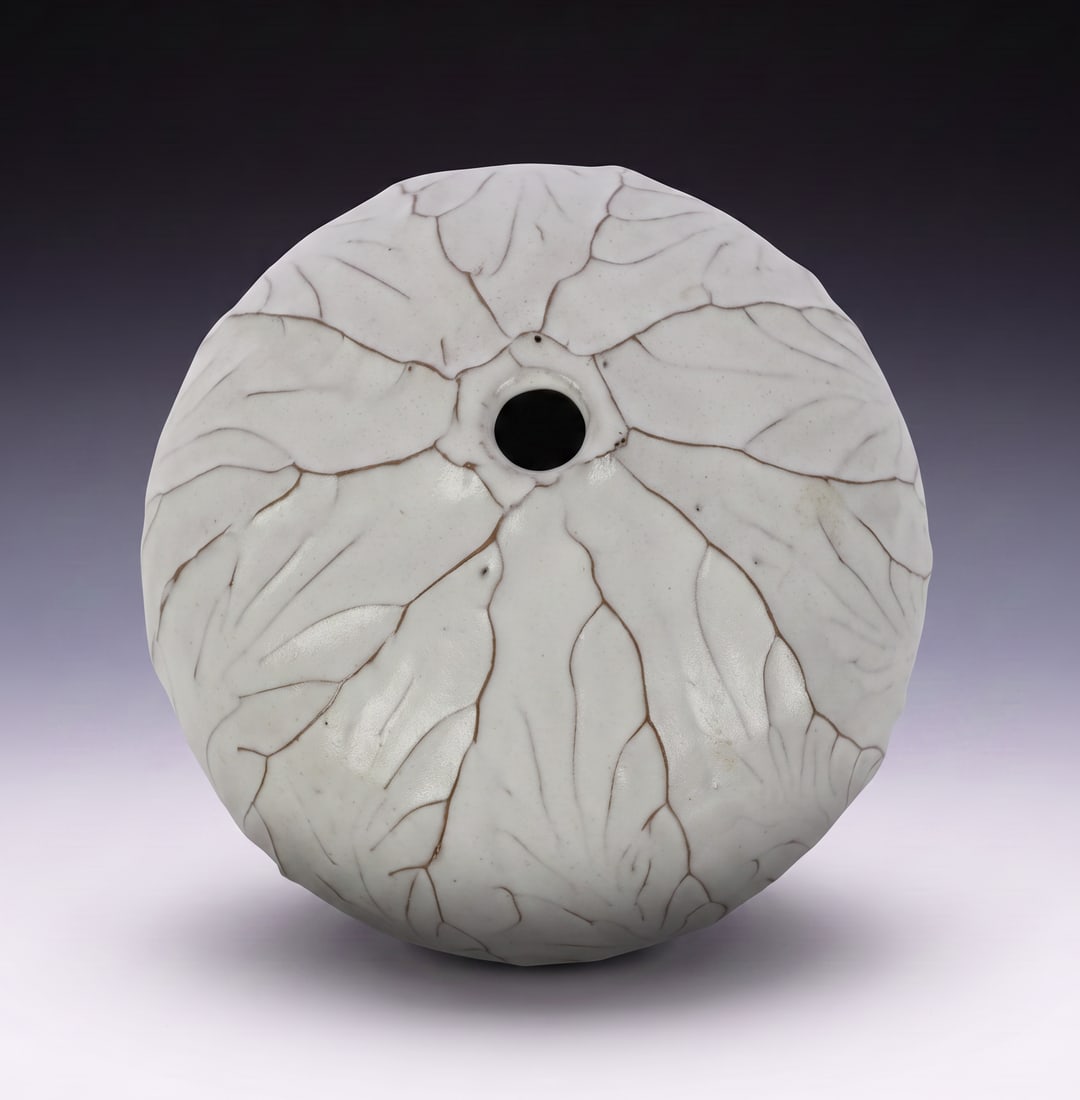 CABBAGE-FORM STUDIO ART POTTERY CONTEMPORARY SCULPTURAL VASE: Lot Description This auction features an intriguing piece of contemporary studio art pottery. The vessel takes a striking spherical, seed-like form, heavily inspired by organic and botanical elements.