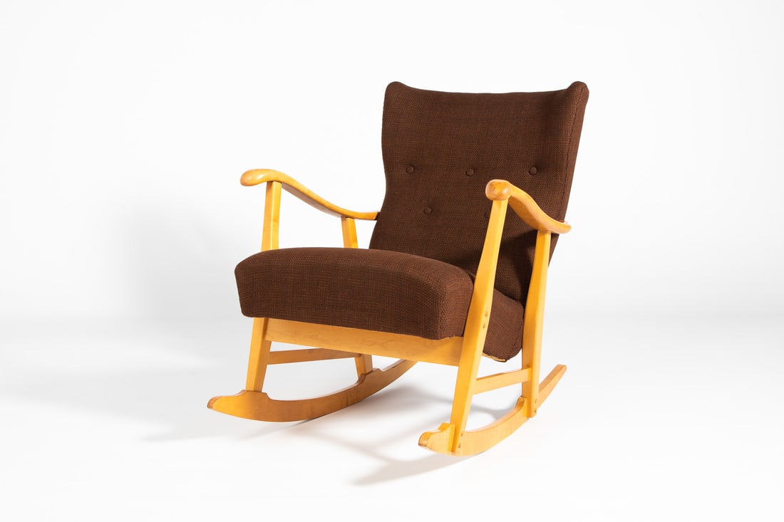 Rocking chair by Elias Svedberg for Nordiska Kompaniet: A rare rocking chair designed by Elias Svedberg for Nordiska Kompaniet, Sweden 1950s. Frame in varnished maple, upholstered in brown wool fabric.