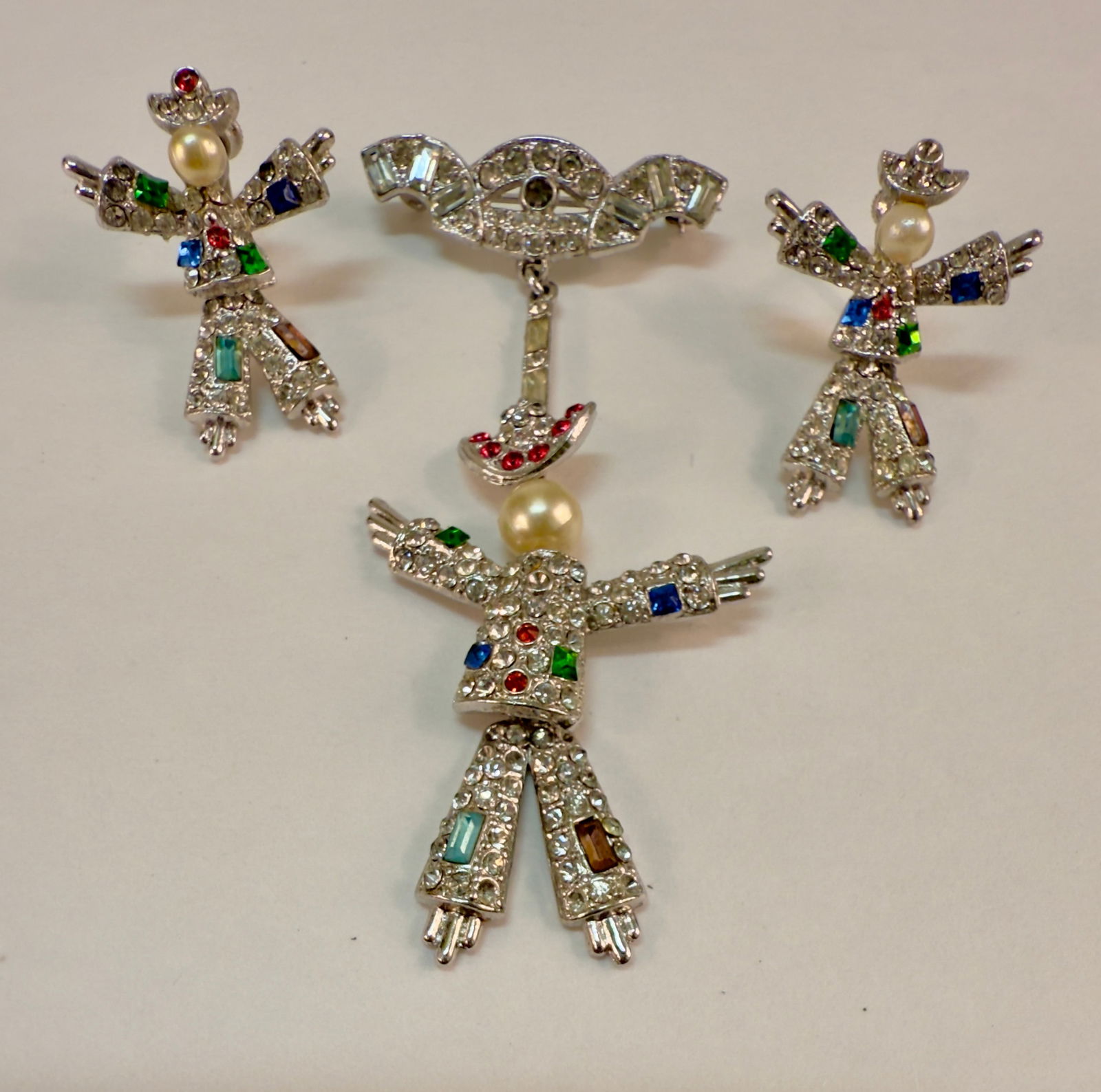 Coro Multi-Color Rhinestone Moving Dancer Mechanical Earrings & Pin: From an upstate, NY estate collection. Unmarked set of Coro Moving Mechanical Dancer pin or brooch and screw back earrings set. Colorful clown-like style, with faux pearl faces and colorful and clear