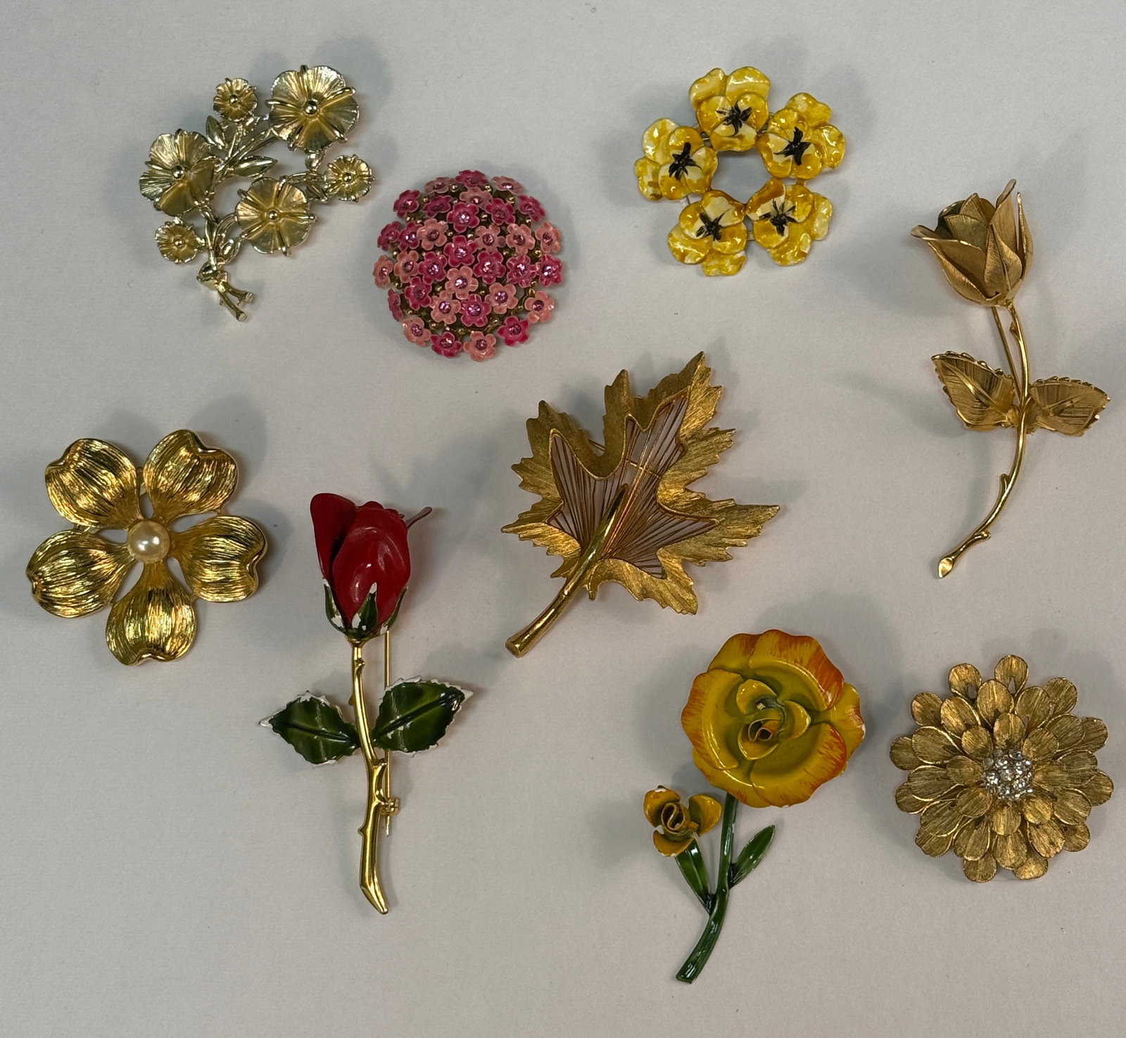 Group of 9 Vintage Costume Flower Leaf Floral Rhinestone Enamel Pins Brooches: From an upstate, NY estate collection. Group of nine vintage 1950s-80s floral / flower / leaf pins or brooches. Some enamel, some gold tone with rhinestones or faux pearl.