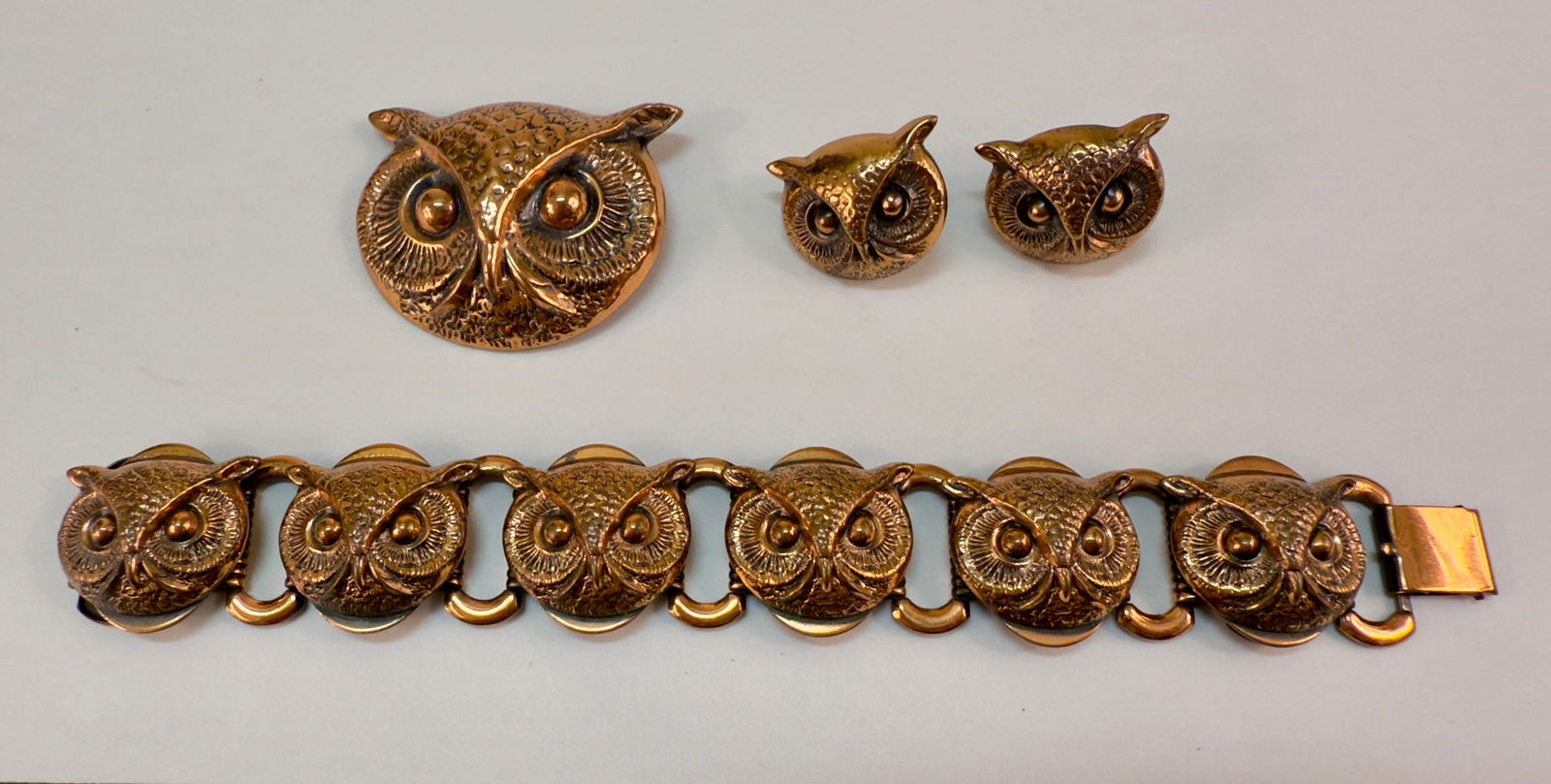 Vintage 60s Copper Owl Parure Pin Earrings Bracelet Set Style of Joseff of Hollywood: From an upstate, NY estate collection. Set or parure of three pieces, brass 1960s vintage owls, in the style of Joseff of Hollywood. Bracelet, pin / brooch, and screw back earring pair. None are marke