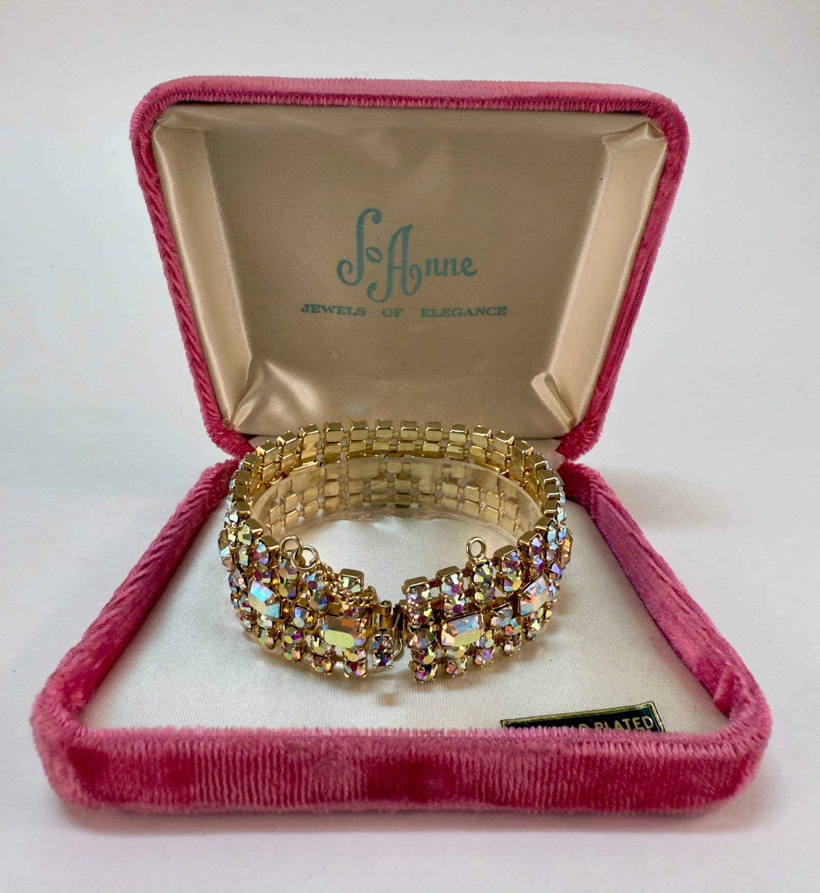 NWB JoAnne Jewels of Elegance 24K Plated Aurora Borealis Rhinestone Bracelet: From an upstate, NY estate collection. Absolutely stunning, vintage new-in-box JoAnne Jewels of Elegance aurora borealis rhinestone bracelet. 24K gold plated. Appears entirely unworn. Has safety clasp