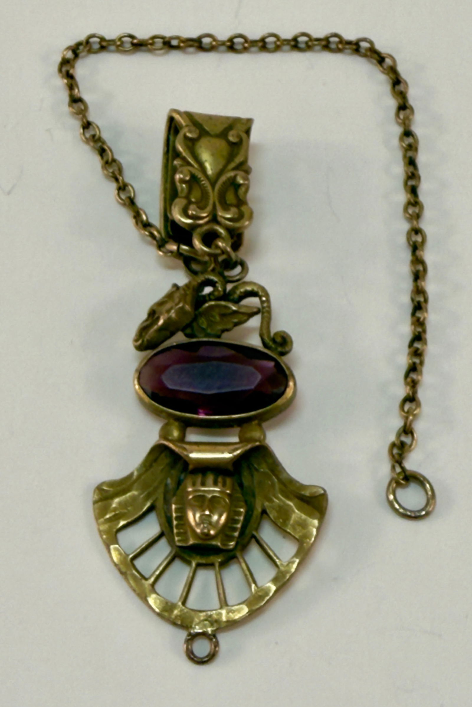 Antique Egyptian Revival Gold Filled Watch Fob and Chain: From an upstate, NY estate collection. Late 19th-early 20thC watch fob or partial chatelaine with Egyptian Revival motif and amethyst colored glass stone. Marked CNS & CO. Charm and hook measure appro