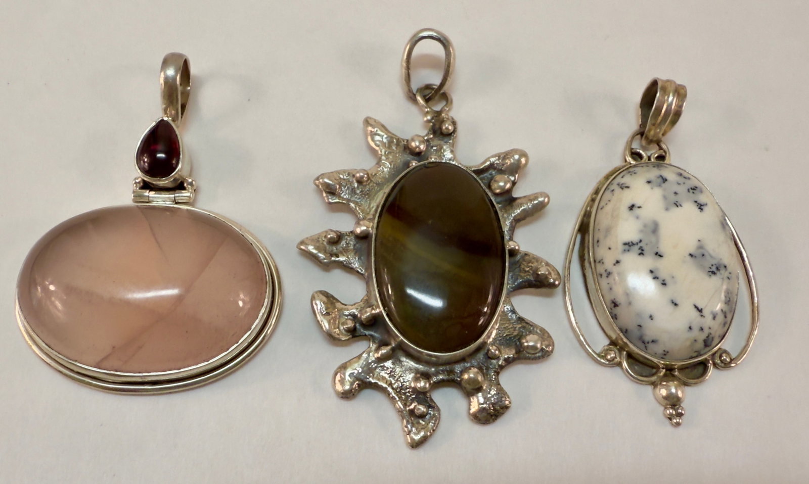 Group of Three Sterling Silver & Semi-Precious Stone Pendants: From an upstate, NY estate collection. Group of three sterling silver and semi-precious stone pendants. All are marked and tested sterling. Group weighs a total of 63.2 grams.