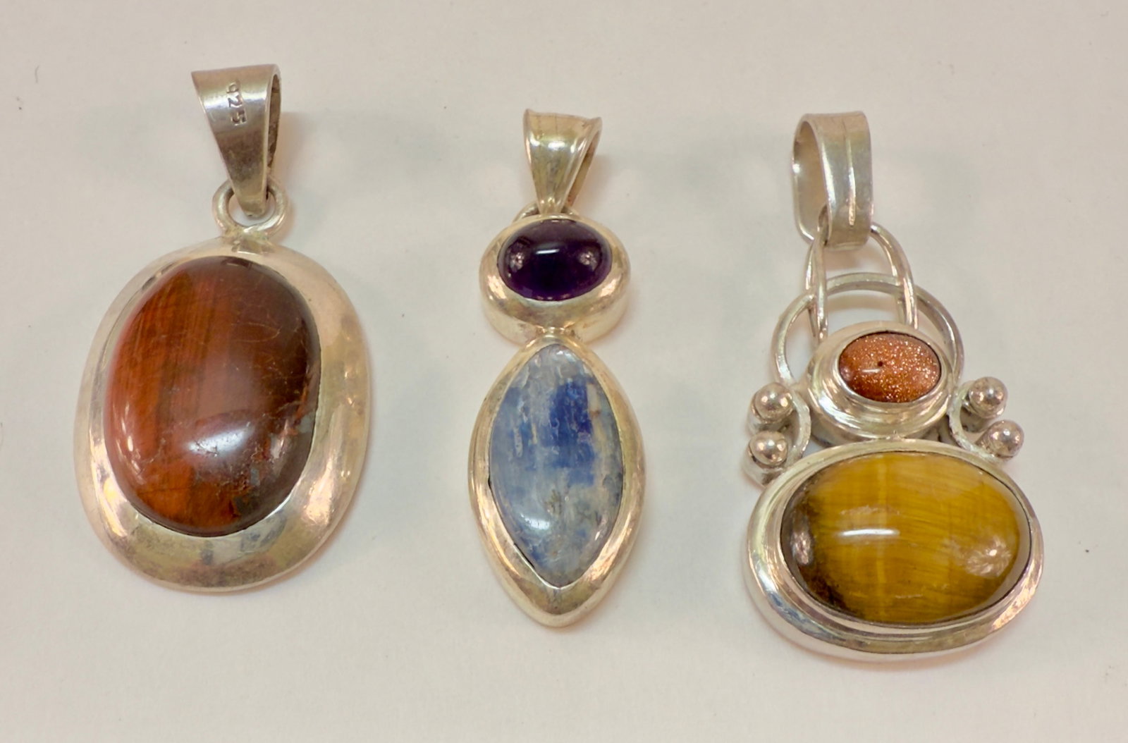 Group of Three Sterling Silver & Semi-Precious Stone Pendants: From an upstate, NY estate collection. Group of three sterling silver and semi-precious stone pendants. All are marked and tested sterling. Group weighs a total of 40.4 grams.