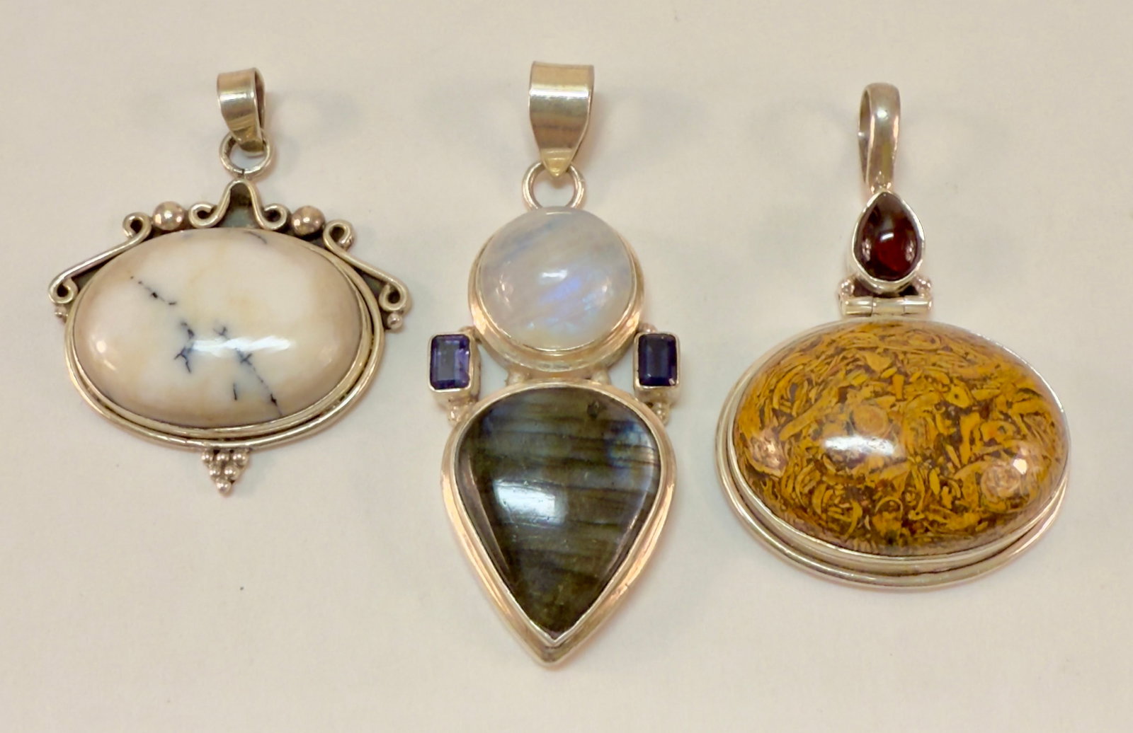 Group of Three Sterling Silver & Semi-Precious Stone Pendants: From an upstate, NY estate collection. Group of three sterling silver and semi-precious stone pendants. All are marked and tested sterling. Group weighs a total of 64.8 grams.