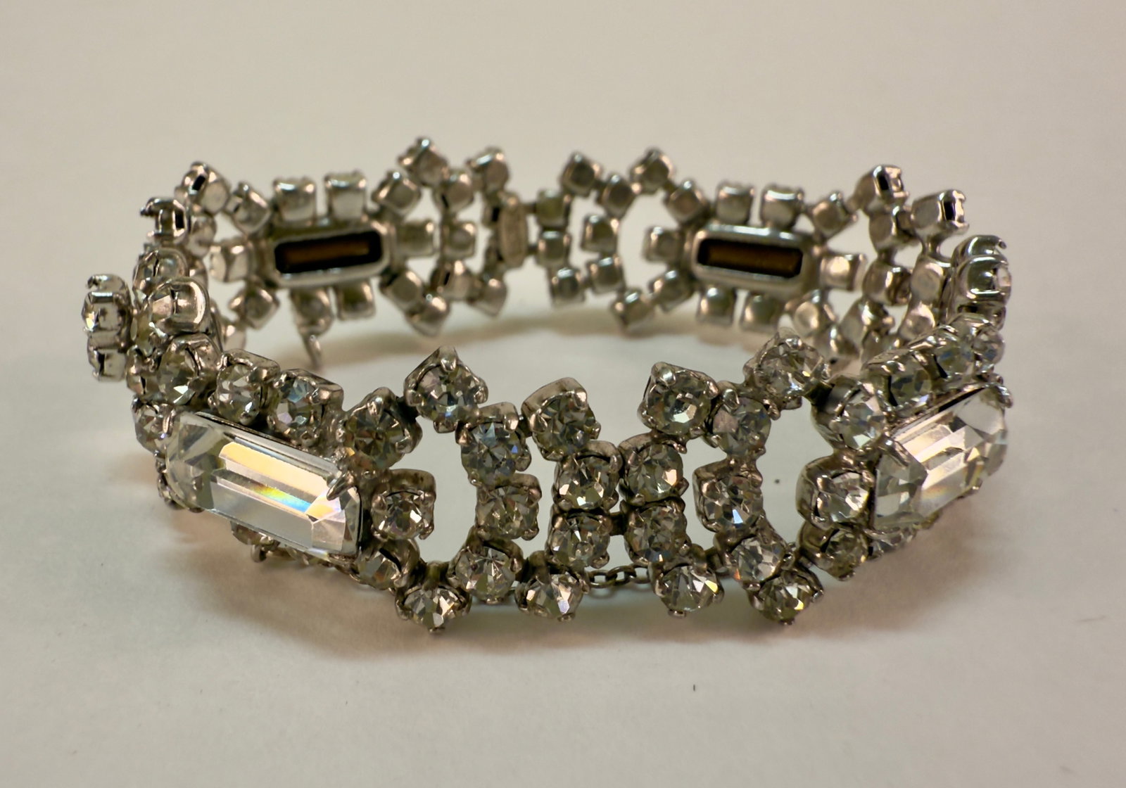 Vintage Sterling Silver & Rhinestone Bracelet Kramer: From an upstate, NY estate collection. Classic 1940s-50s vintage sterling silver rhinestone bracelet by Kramer. Marked. Box clasp, with safety chain attached. Measures approx 6" long by just under .75