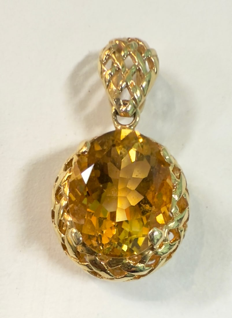 Vintage 14K Gold Oval Cut Citrine Pendant Box Setting: From an upstate, NY estate collection. Vintage large oval cut citrine and set in 14K yellow gold pendant or charm. Box setting. Citrine has 2.4 carat weight and measures 10mm x m8m. Marked on reverse 