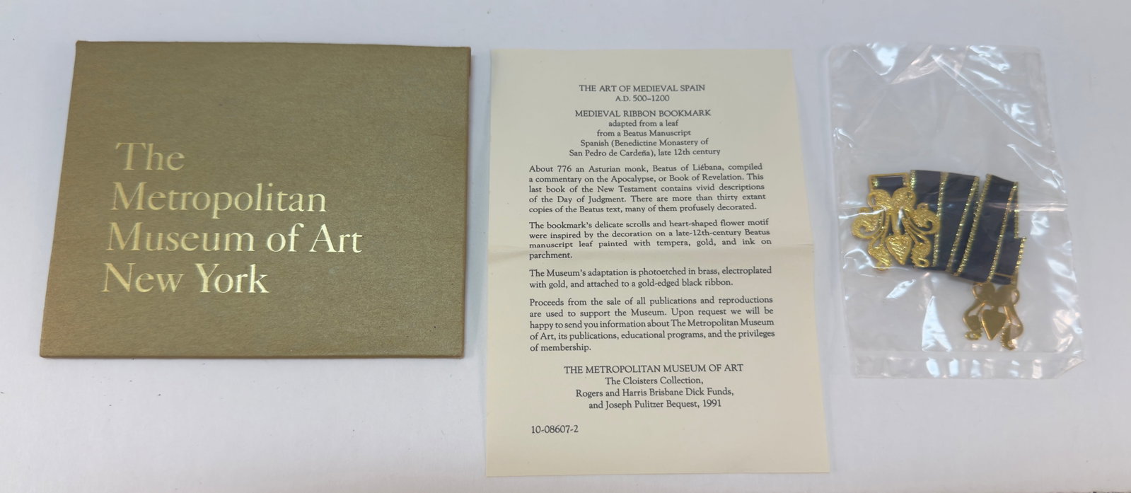 David Howell Designer Medieval Ribbon Bookmark: From an upstate, NY estate collection. Medieval Ribbon Bookmark, crafted of metal with purple ribbon. Historical design inspired, designed by David & Howell & Co. New in card envelope with original pa