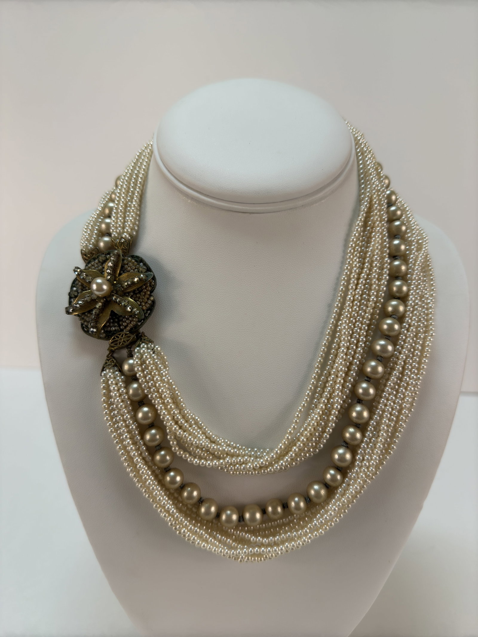 Fabulous Original By Robert Faux Pearl Multistrand Necklace: From an upstate NY collection. Rare Original By Robert multistrand twist faux pearl necklace. With star flower motif on clasp, with faux pearl and rhinestones. Box clasp, signed on back. Measures appr