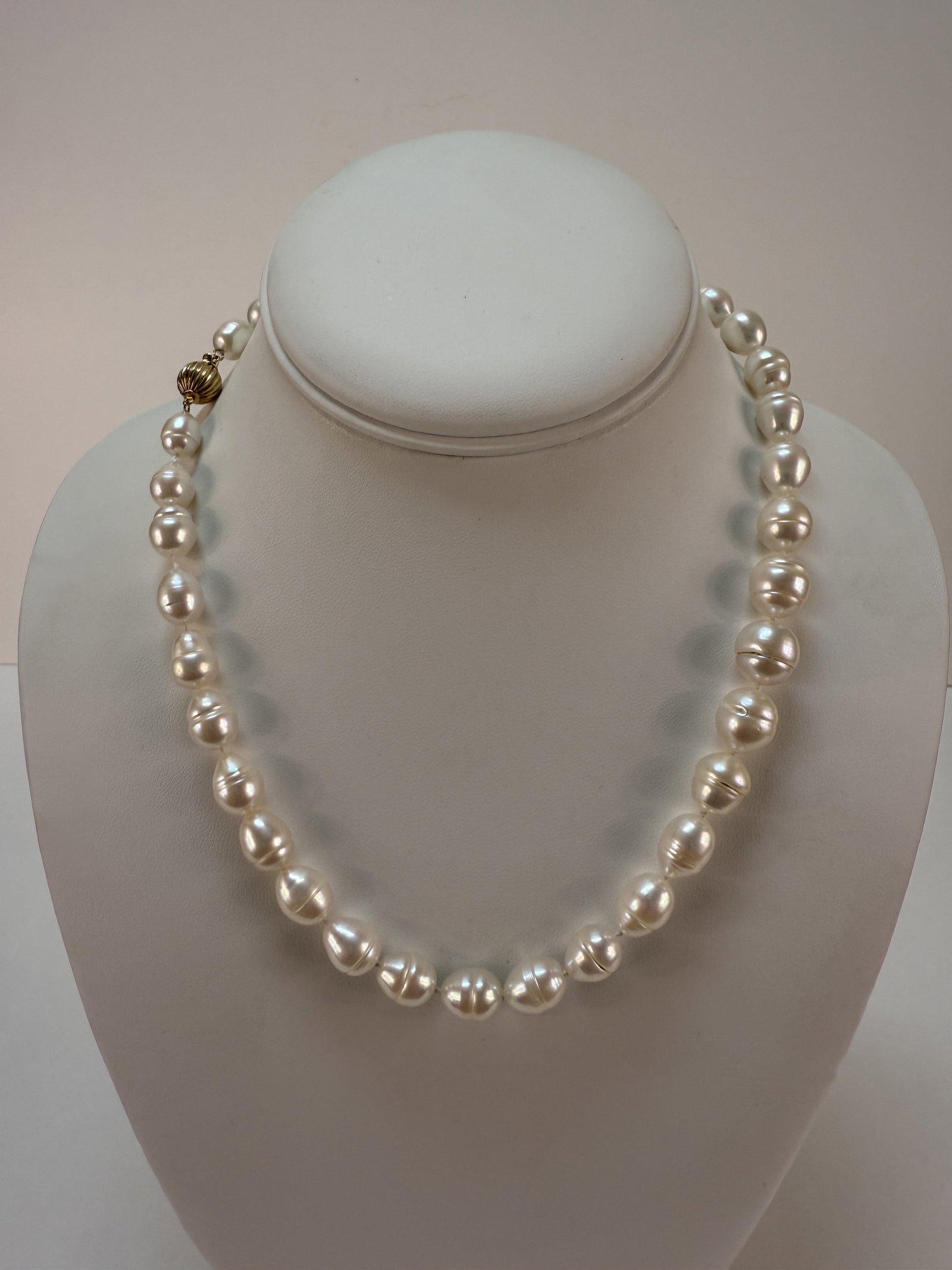 Baroque Pearl 14K Yellow Gold Bead Clasp Necklace: From an upstate NY estate collection. Lovely baroque pearl necklace with 14K yellow gold bead / box clasp. Marked on clasp and tested. Necklace measures approx 18" long. Pearls each measure approx 9-1