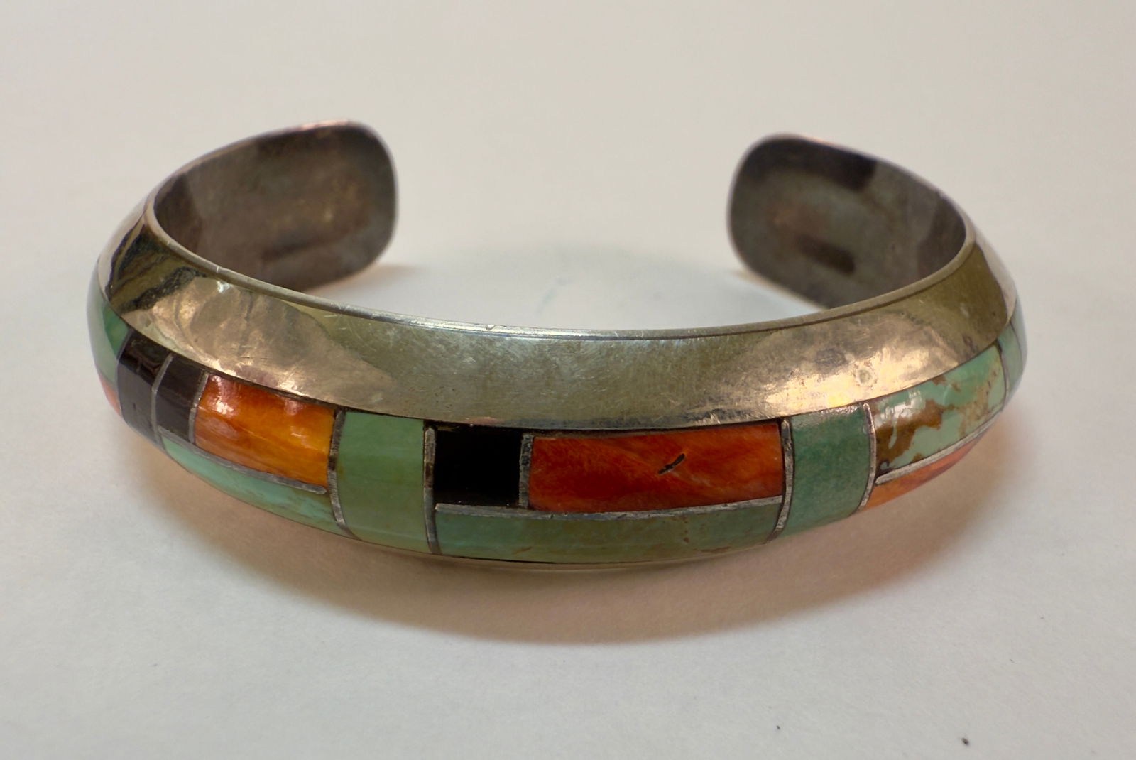 Sterling Silver Turquoise Coral & Obsidian Inlaid Navajo Bracelet BB: From the estate of a Scranton, PA collector. Stunning solid sterling silver inlaid Navajo cuff bracelet, deeply inlaid with turquoise, obsidian and two shades of coral. Marked BB (perhaps for Bernice