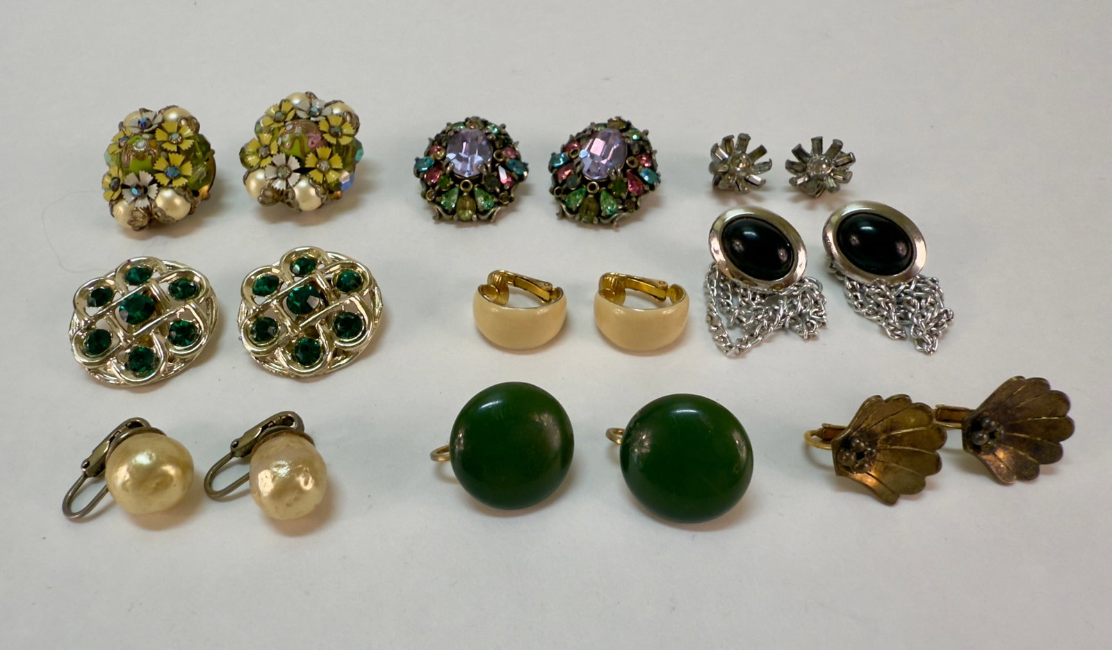 Group of Nine Pairs of Vintage Clip On Earrings Sterling Hollycraft +: From an upstate, NY estate collection. Nine pairs of vintage clip on and screw back earrings, some signed such as Hollycraft and Marvella. One pair of gilt sterling silver screw back earrings.