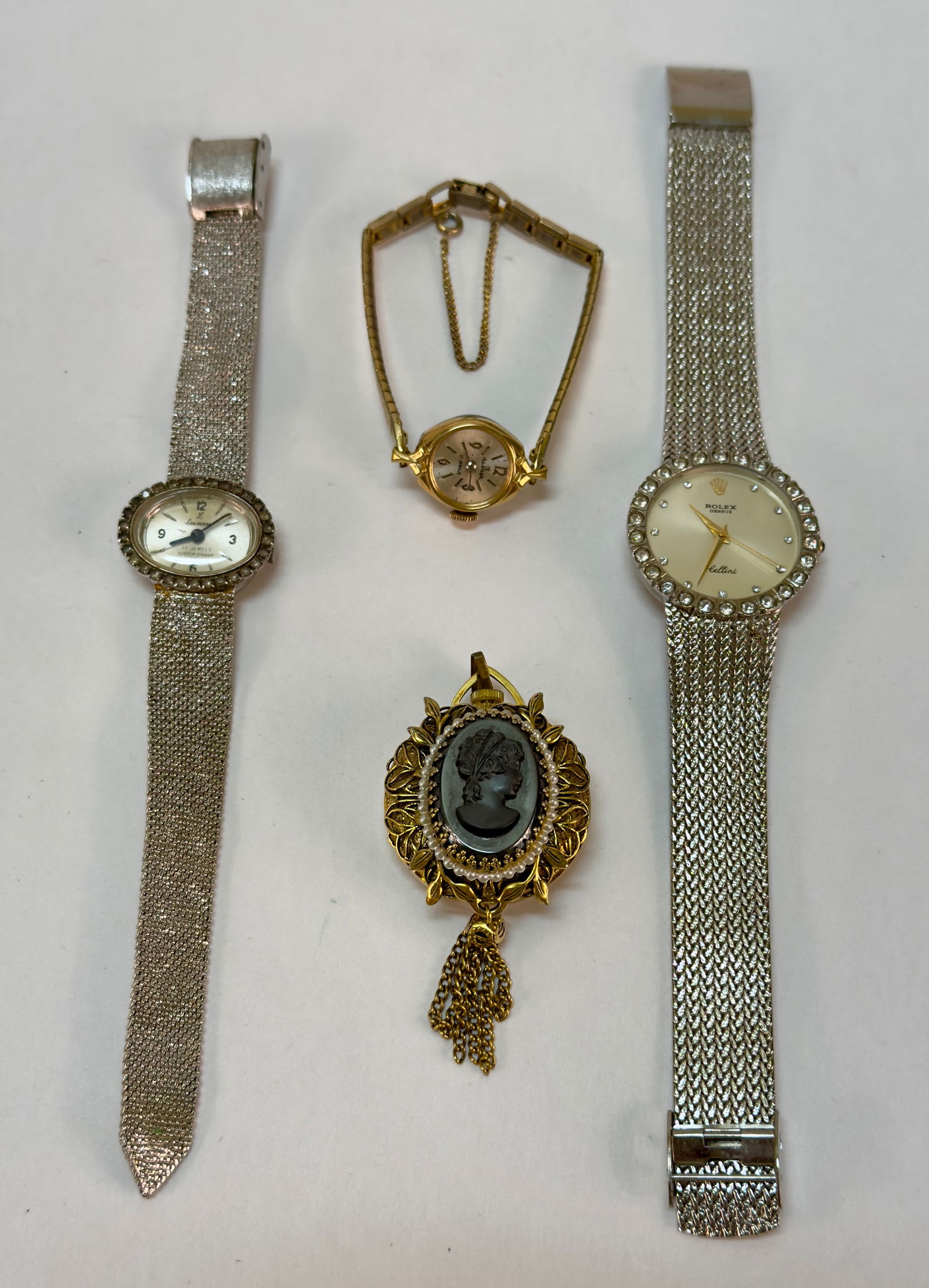 Group of Four Vintage Costume Jewlery Watches: From an upstate, NY estate collection. Group of four vintage watches including two by Lausanne, one by Alpha, and one faux / replica Rolex. None are tested / need batteries.