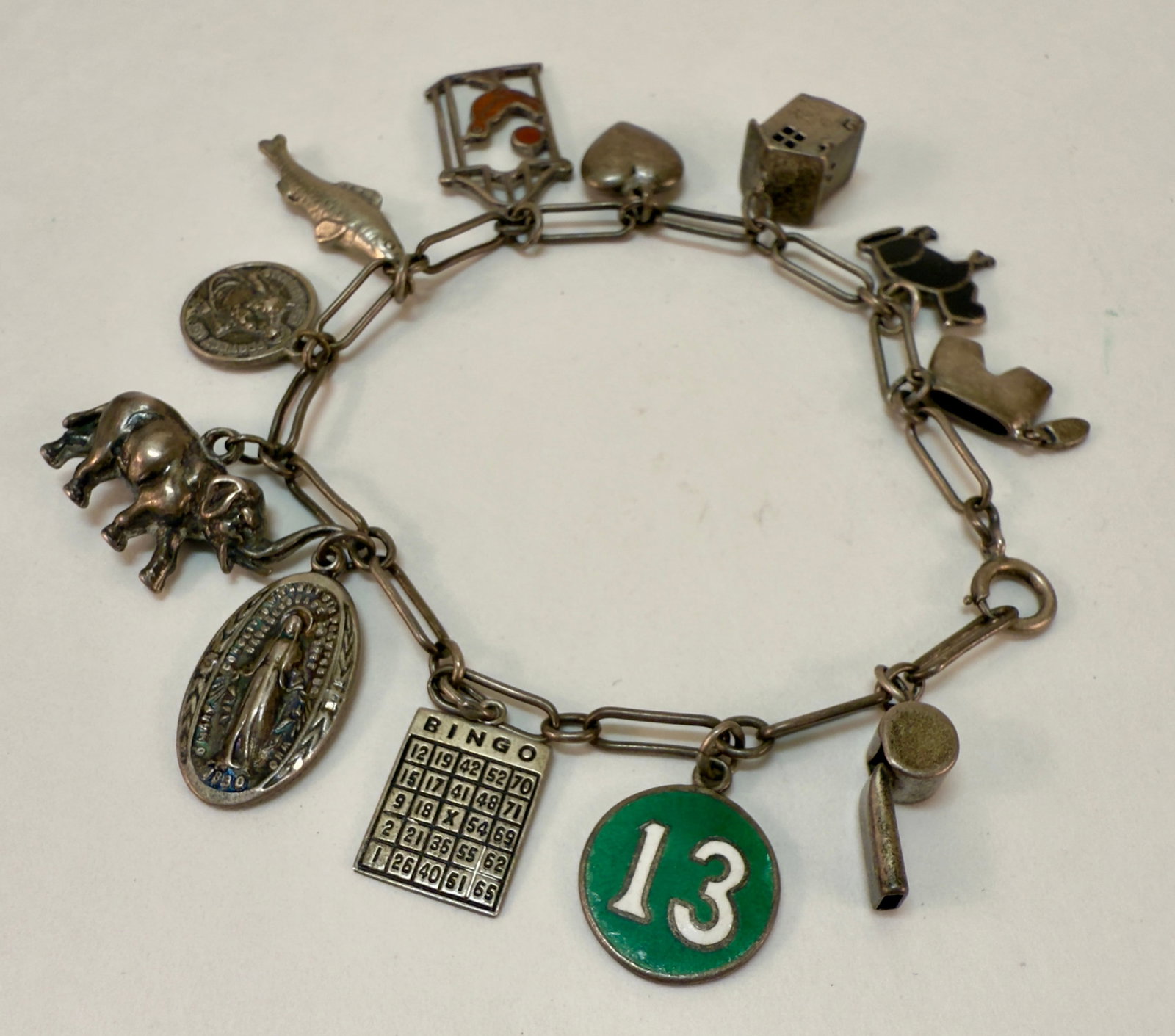 Adorable Sterling Silver Link Charm Bracelet Figural Enamel: From an upstate, NY estate. Very sweet open link sterling silver charm bracelet. With a number of fun charms including some enamel decorated ones. Measures approx 7.5" long. Weight is approx 20 grams.