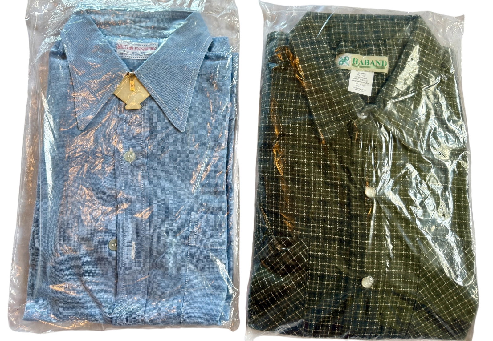 Pair of Vintage Men's Buttopn Down Shirts: From an upstate, NY estate. Pair of vintage button-down shirts within plastic packaging. One cotton blend flannel Haband with pearly snaps and one light blue silk blend light dress shirt with minor we