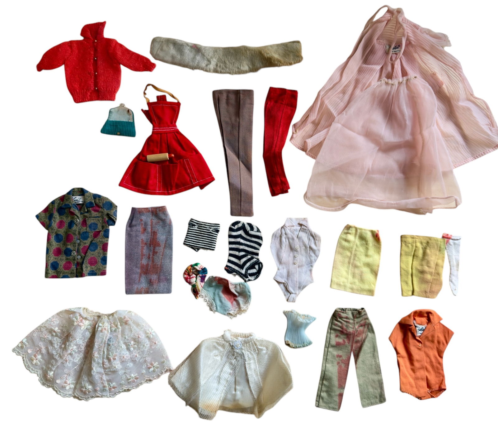 Group of Twenty-Three Pieces 1960s Vintage Barbie and Ken Fashion Clothing: From an upstate, NY estate collection. Group of twenty-three 1960 vintage Barbie and Ken fashion garments / clothing pieces. Many have original tags reading "Barbie(r) by Mattel" or "Ken (TM) by Matte