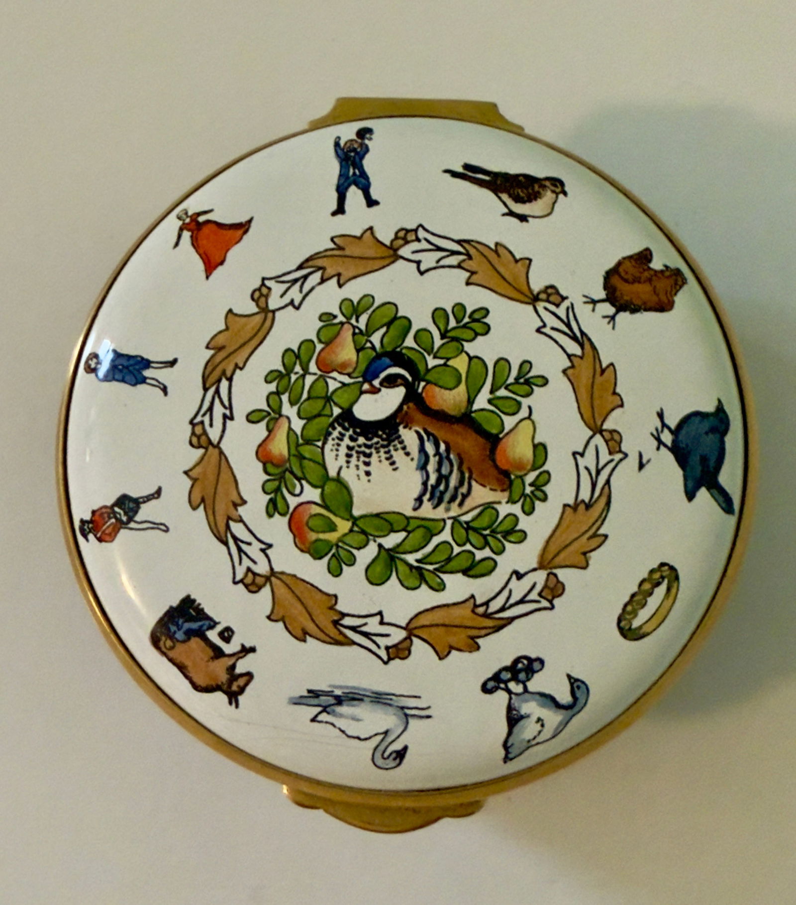 Christmas Porcelain Pill Box Enamel Limited Edition "12 Days of Christmas" Staffordshire Enamels: From an upstate, NY estate. Lovely Christmas Box, made by Staffordshire Enamels, England. Hand painted lid with The 12 Days of Christmas, in enamel. Measures approx 2.5" in diameter.
