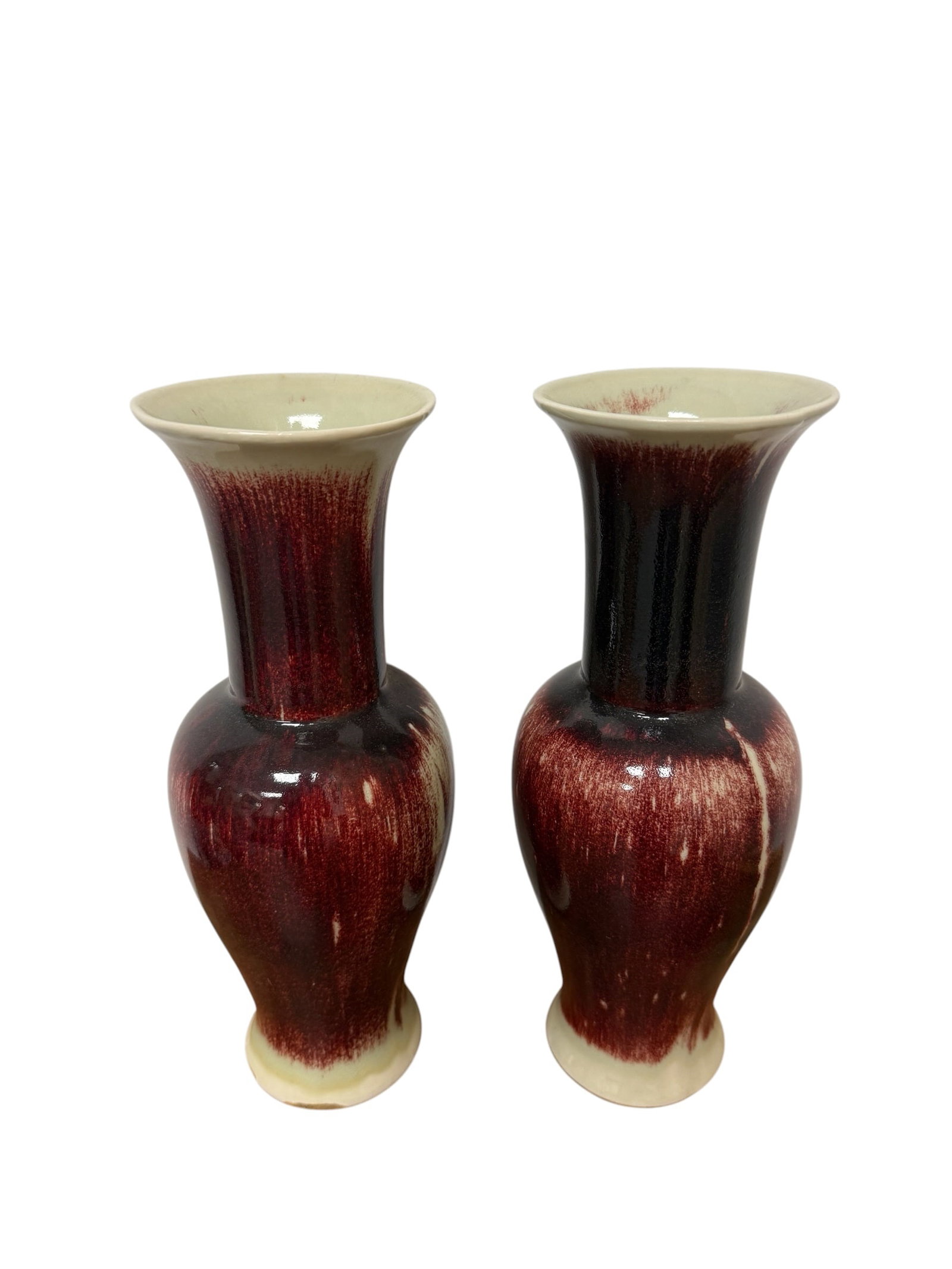 Pair of Chinese 20thC Oxblood Glaze Vases: From an upstate, NY estate. Matched pair of Chinese 20thC oxblood glaze vases. Each measures approx 12.5" x 4.5" x 4.5". Please see photos for details.