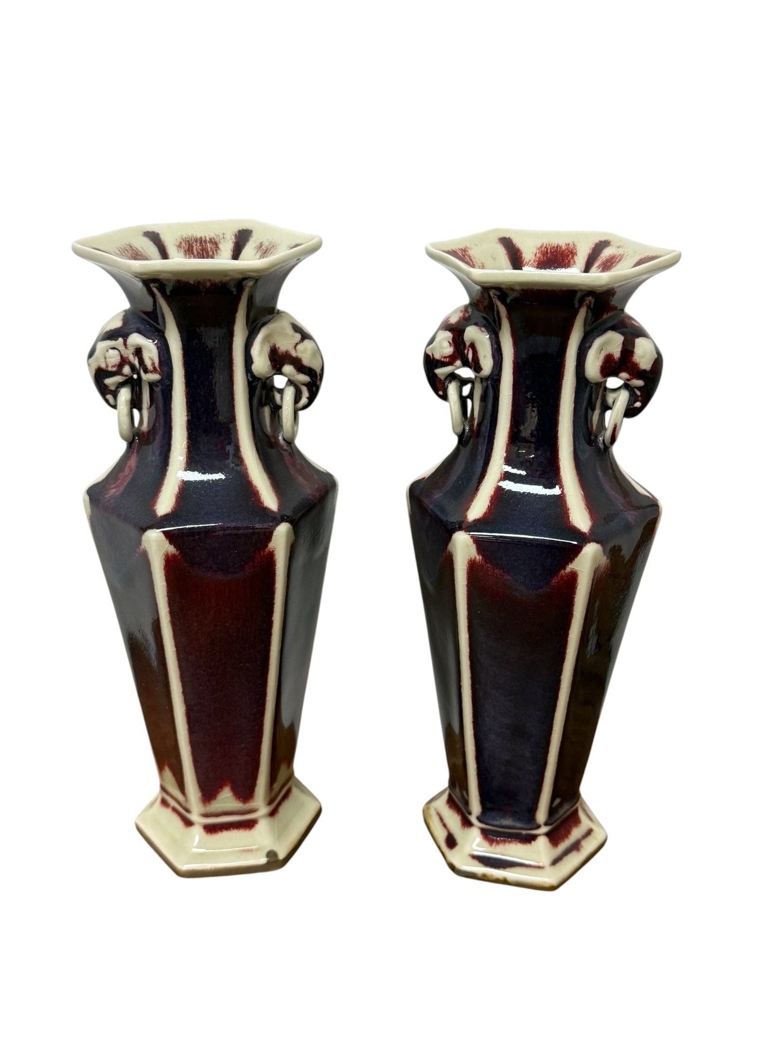 Pair of Chinese 20thC Oxblood Glaze Vases: From an upstate, NY estate. Matched pair of Chinese 20thC oxblood glaze vases, with handles. Each measures approx 10.5" x 4.25" x 4.25". Please see photos for details.