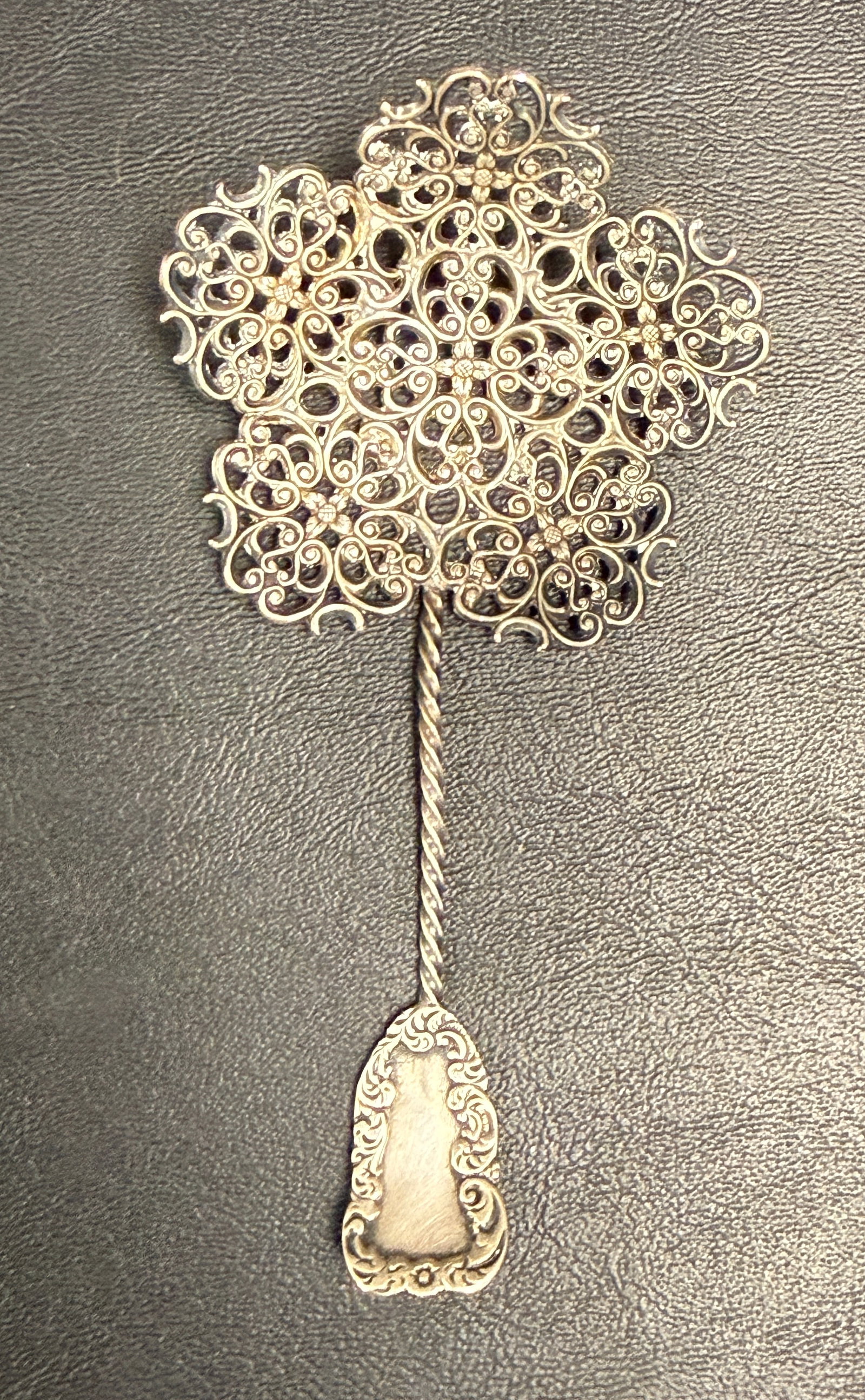 Ornate Antique Sterling Silver Filigree Bonbon Spoon: From an upstate, NY estate. Incredible antique sterling silver filigree bonbon spoon, marked. Measures approx 4.25" long and weighs approx 8 grams. Please see photos for details.