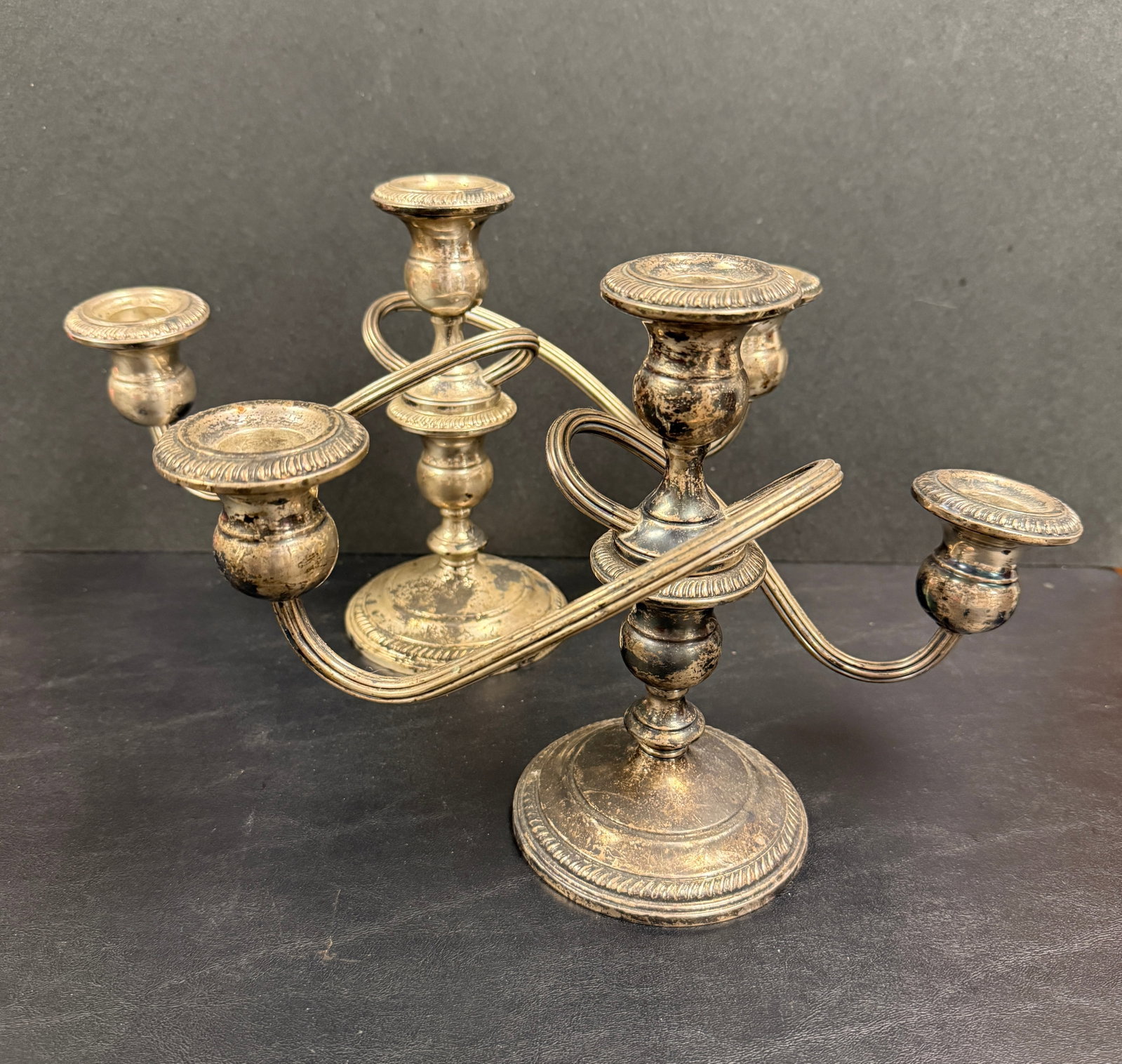 Pair of Fisher Sterling Silver Weighted Candlesticks: From an upstate, NY estate. Pair of Sterling Silver weighted three-arm candelabras, by Fisher. Each measures approx 7.75" x 11.25" x 4".and pair weighs approx 1758 grams. Please see photos for