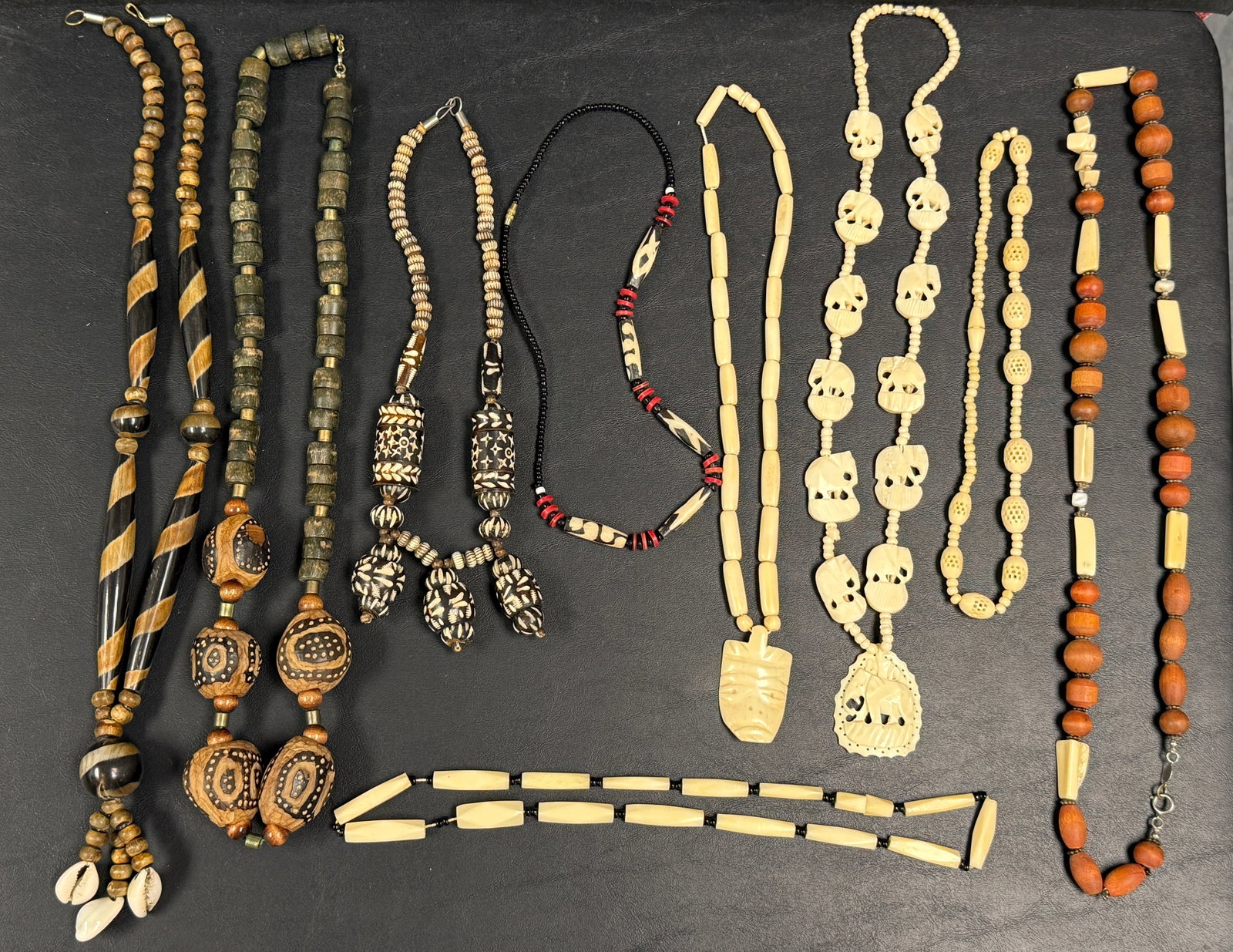 Group of 10 Vintage Beaded & Artisan Necklaces African Asian: From an upstate, NY estate. Vintage group of ten necklaces, including some African beads, carved bone and vegetable, wooden, carved seed, etc. Please see photos for details.