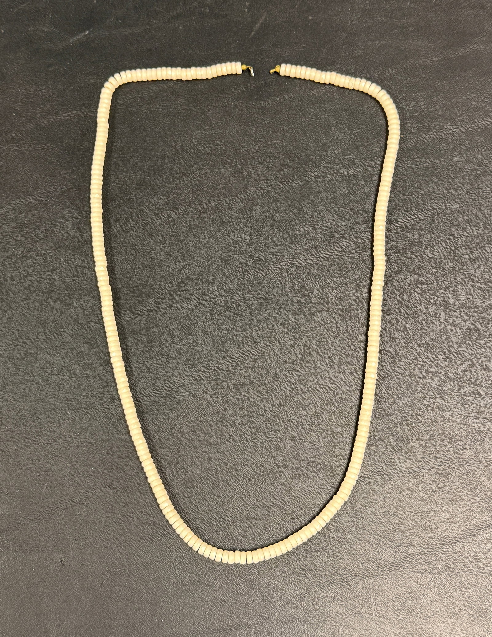 Hawaiian Puka Shell Faceted Long Necklace Vintage: From an upstate, NY estate. Vintage Hawaiian puka shell highly faceted necklace. Measures approx 30.5" long. Missing a clasp. Please see photos for details.