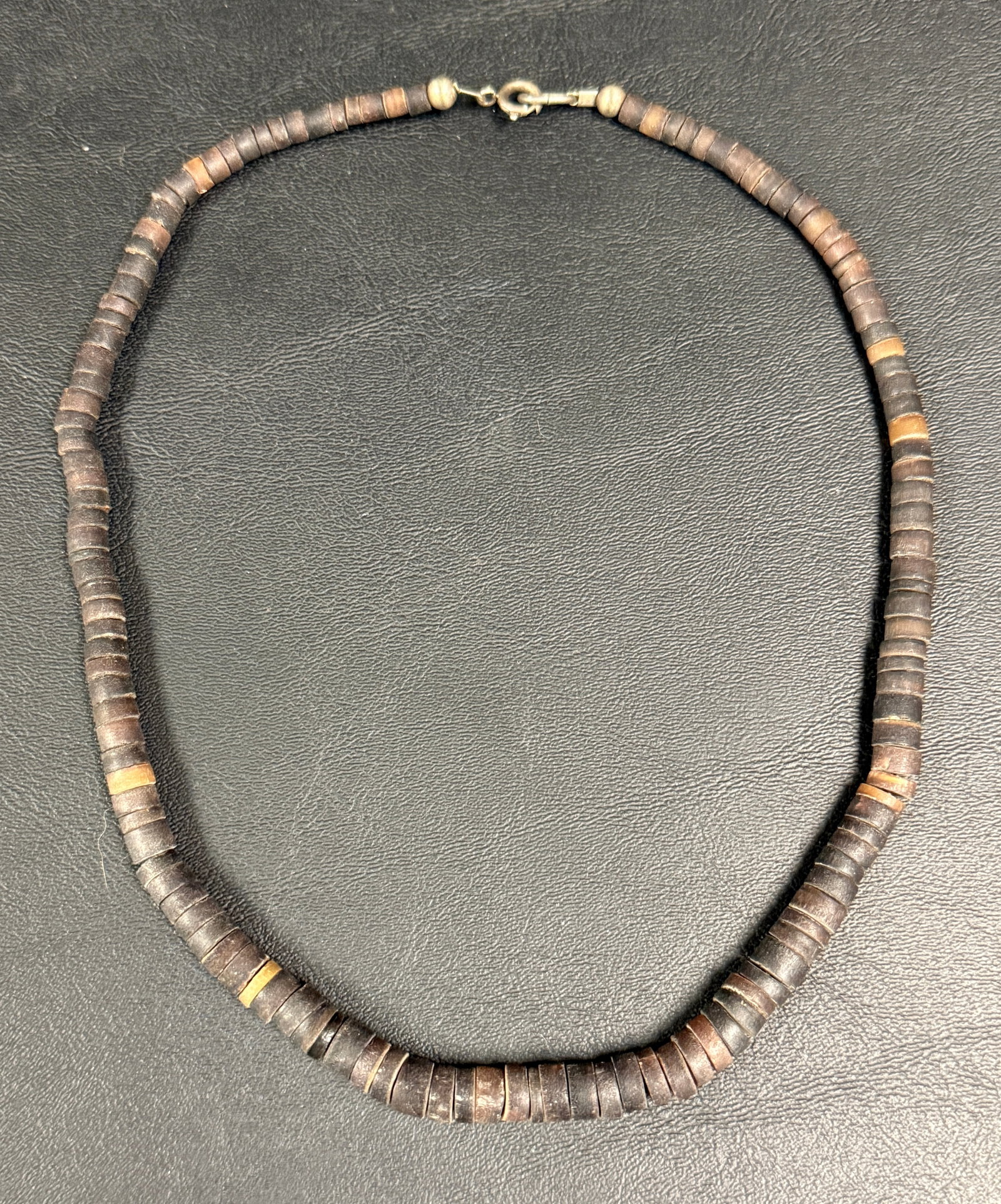 Vintage Coconut Shell Heishi Necklace Graduated: From an upstate, NY estate. Vintage coconut shell Heishi necklace. Measures approx 18" long. Please see photos for details.