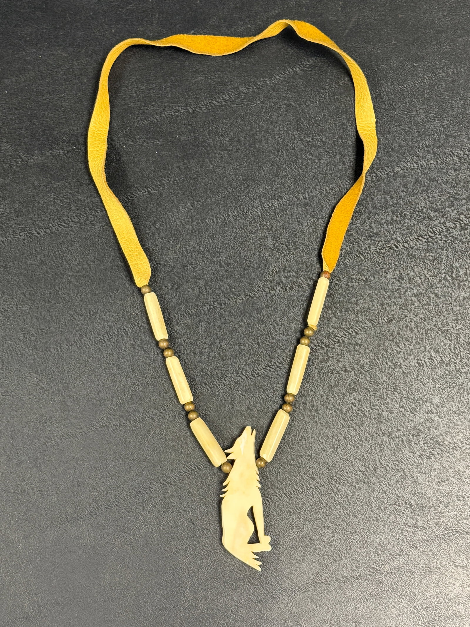 Native American Leather / Carved Bone Wolf Necklace: From an upstate, NY estate. Beautiful Native American carved bone / leather necklace, with howling wolf. Please see photos for details.