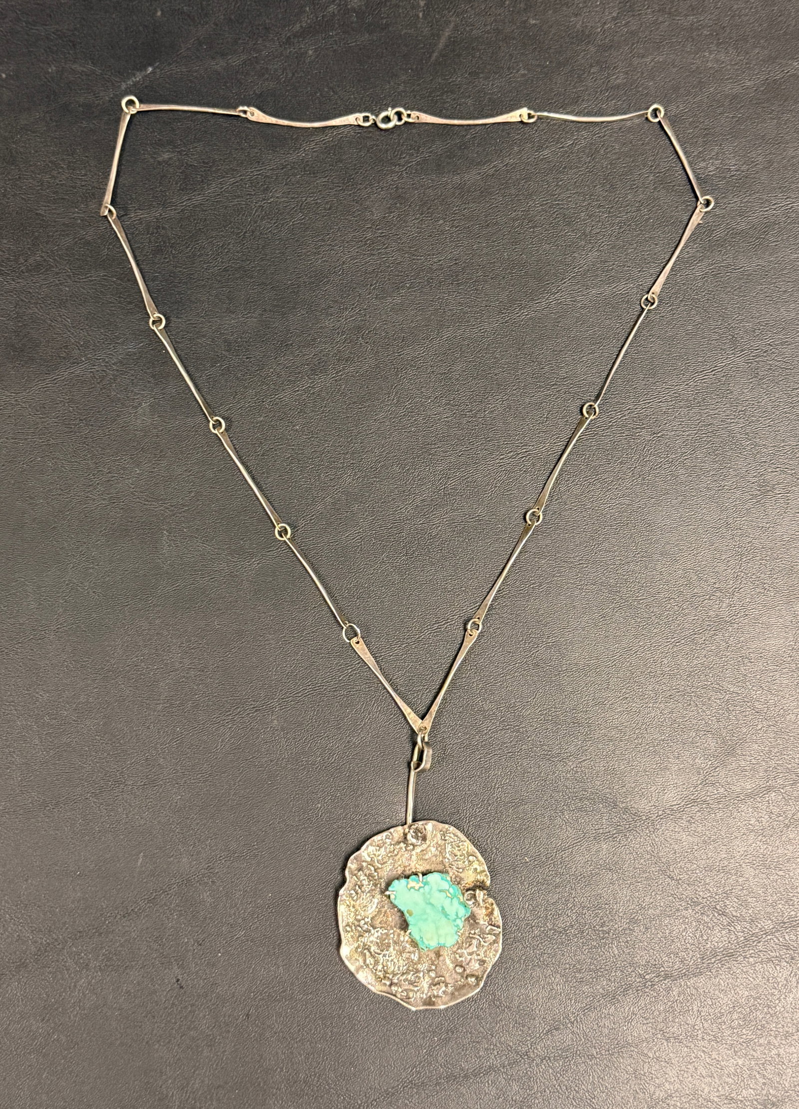 Vintage Artisan Sterling Silver Turquoise Brutalist Necklace: From an upstate, NY estate. Vintage artisan brutalist sterling silver necklace with forged chain and turquoise cabochon. Tested, signed and dated 1973. Weighs approx 41 grams. Please see photos for
