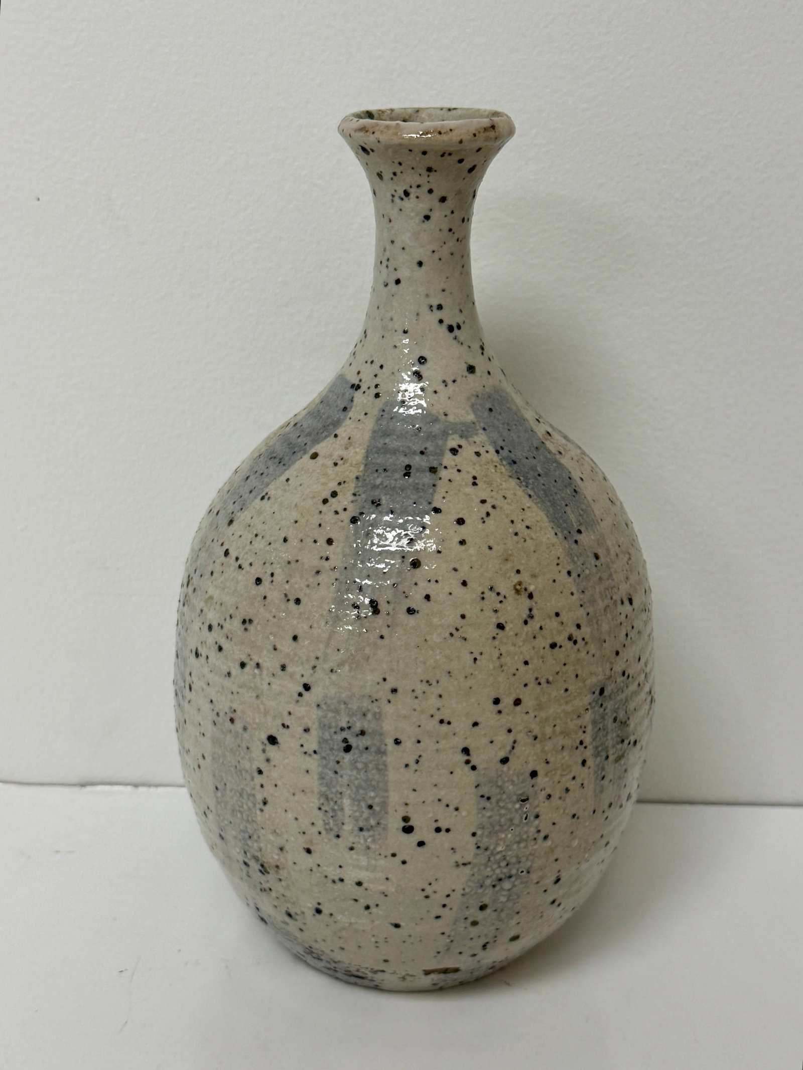J.M. Strange Signed Studio Art Pottery Bottle Vase Seed Pot: From an upstate, NY estate. Signed studio art pottery vessel / vase / bottle / seed pot. Signed on base J.M. Strange, Wichita. Marked on underside. Measures approx 9.5" tall x 5.5" at widest. Please s