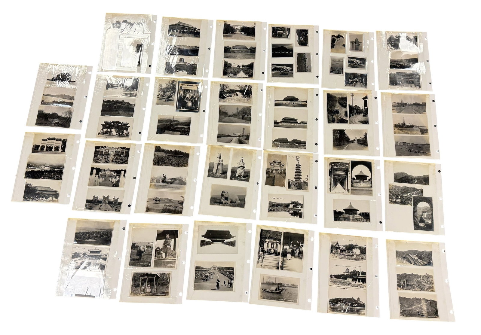 Album of 161 Vintage Photographs Travels China Typhoon Wall +: From an upstate, NY estate. Album containing twenty-six pages, one hundred sixty-one vintage photos of travels in China. Including panoramic format shots, photos of typhoon, military, etc. Pages measu